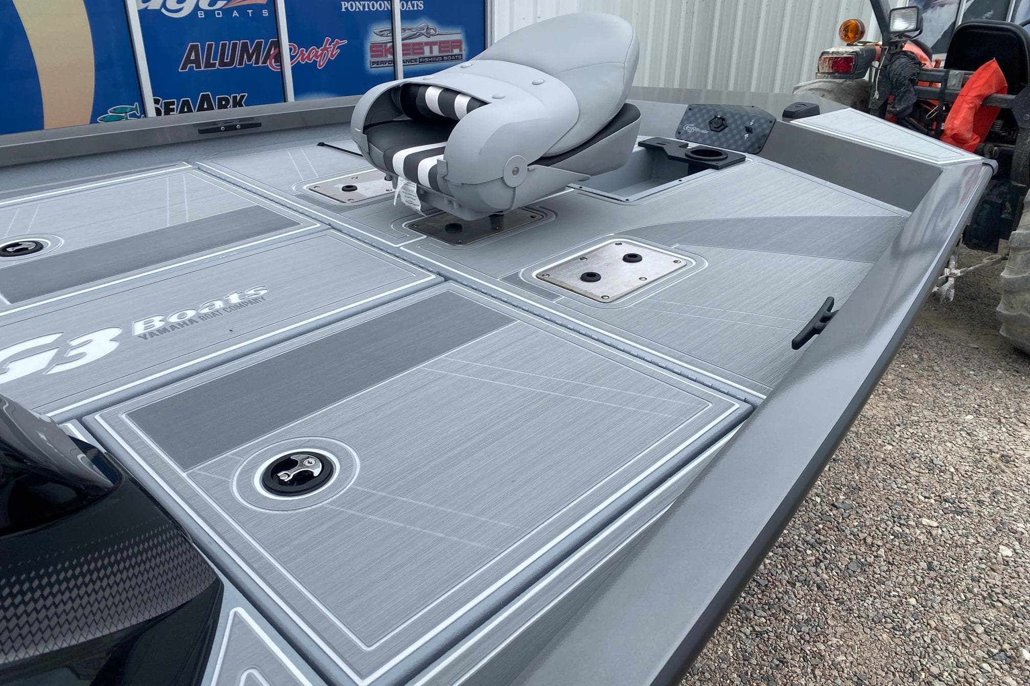 2026 G3 Sportsman 1710 SE boat deck with seating and storage compartments.