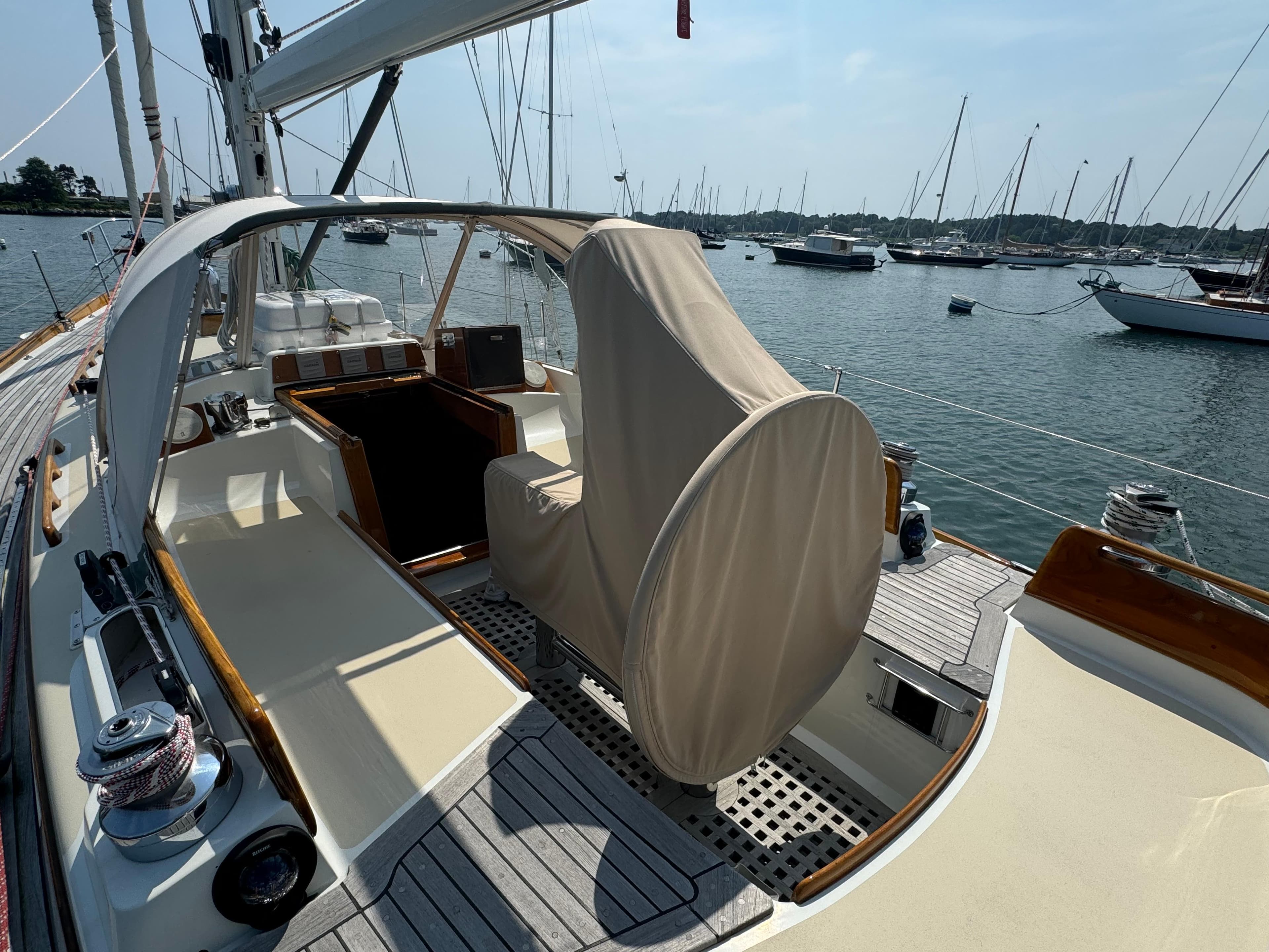 1986 Little Harbor 46 Center Cockpit sailboat with covered helm, docked in a marina.