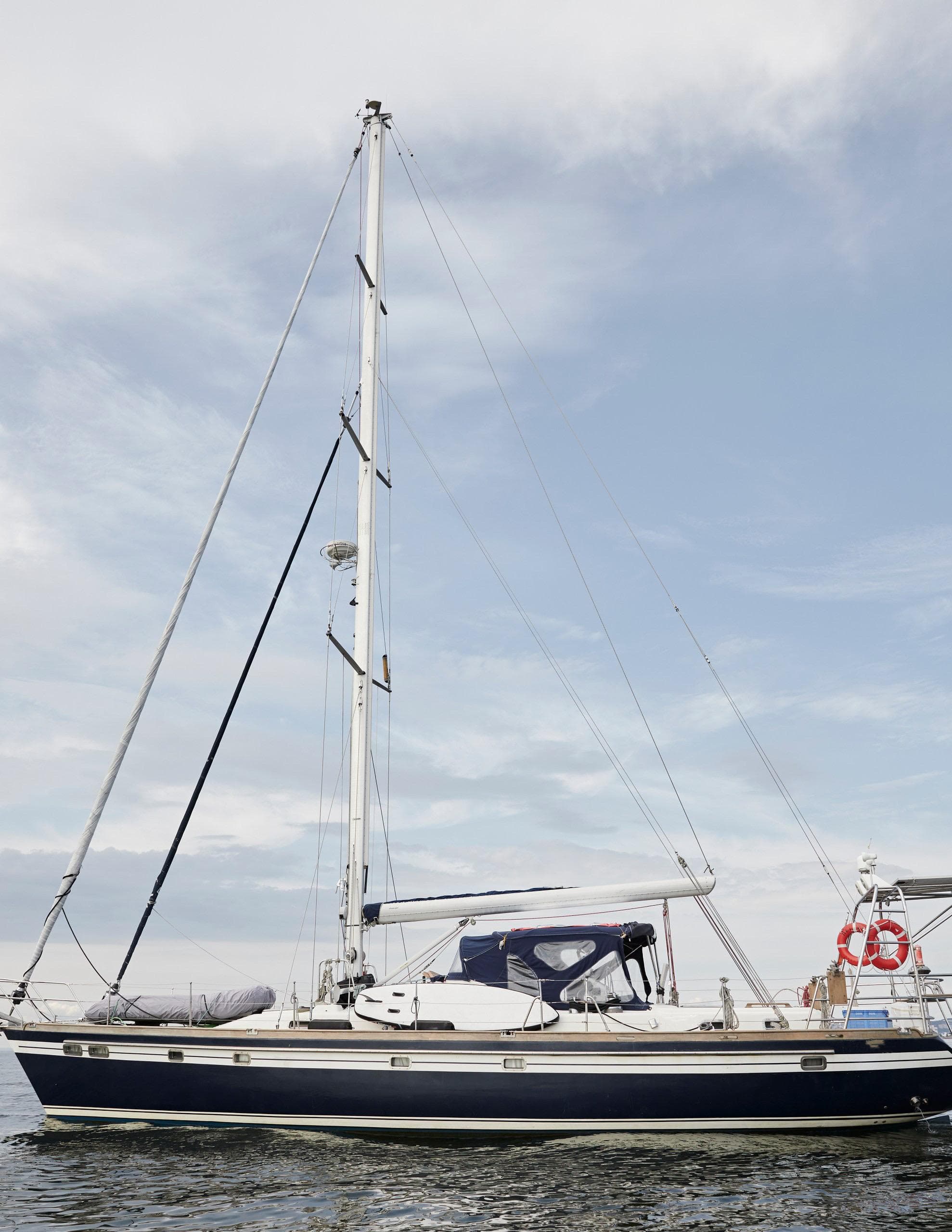 Sailing yacht Tayana 58, 2008 model, on calm waters under a clear sky.