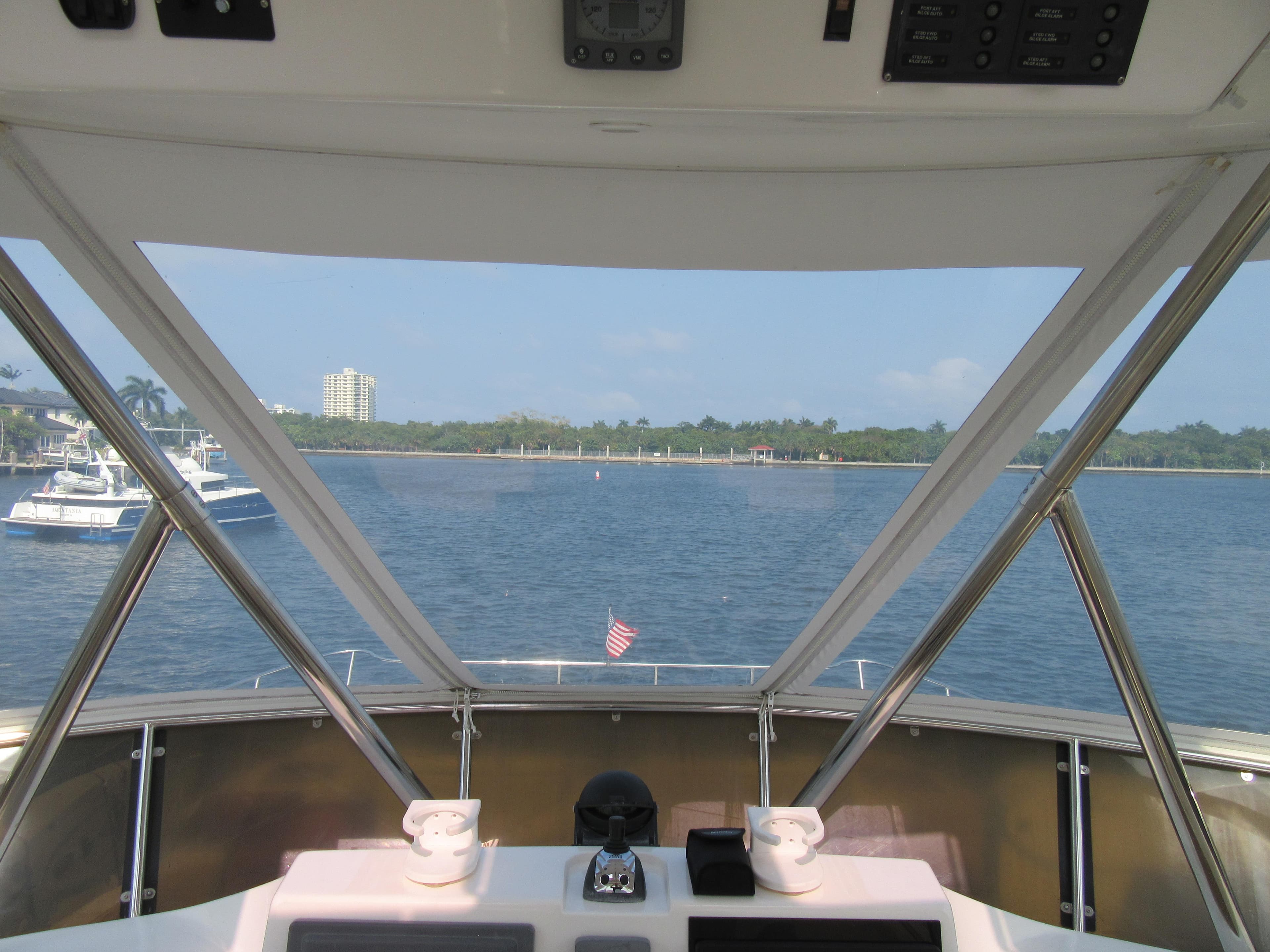 View from Africat Marine 420 yacht, 2008 model, overlooking calm waters and distant shoreline.
