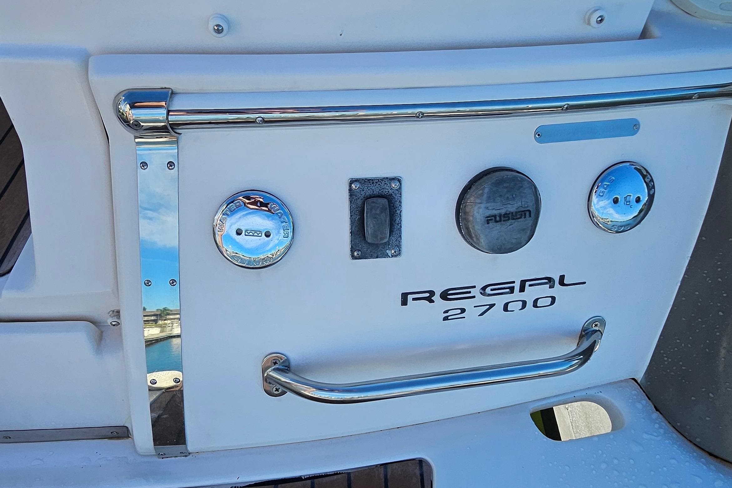 2010 Regal 2700 ES Bowrider boat stern with chrome details and branding.