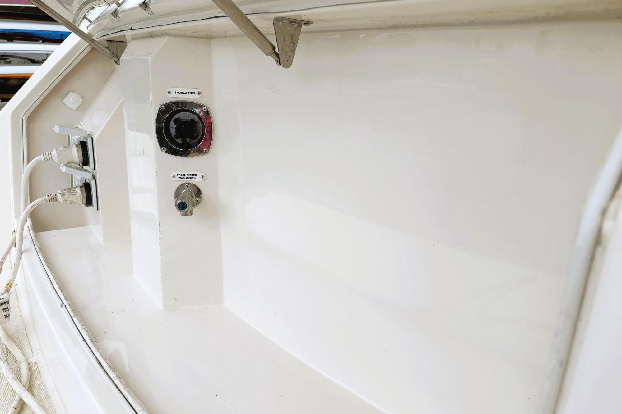 2016 Carver C40 yacht utility panel with shore power and water connections.