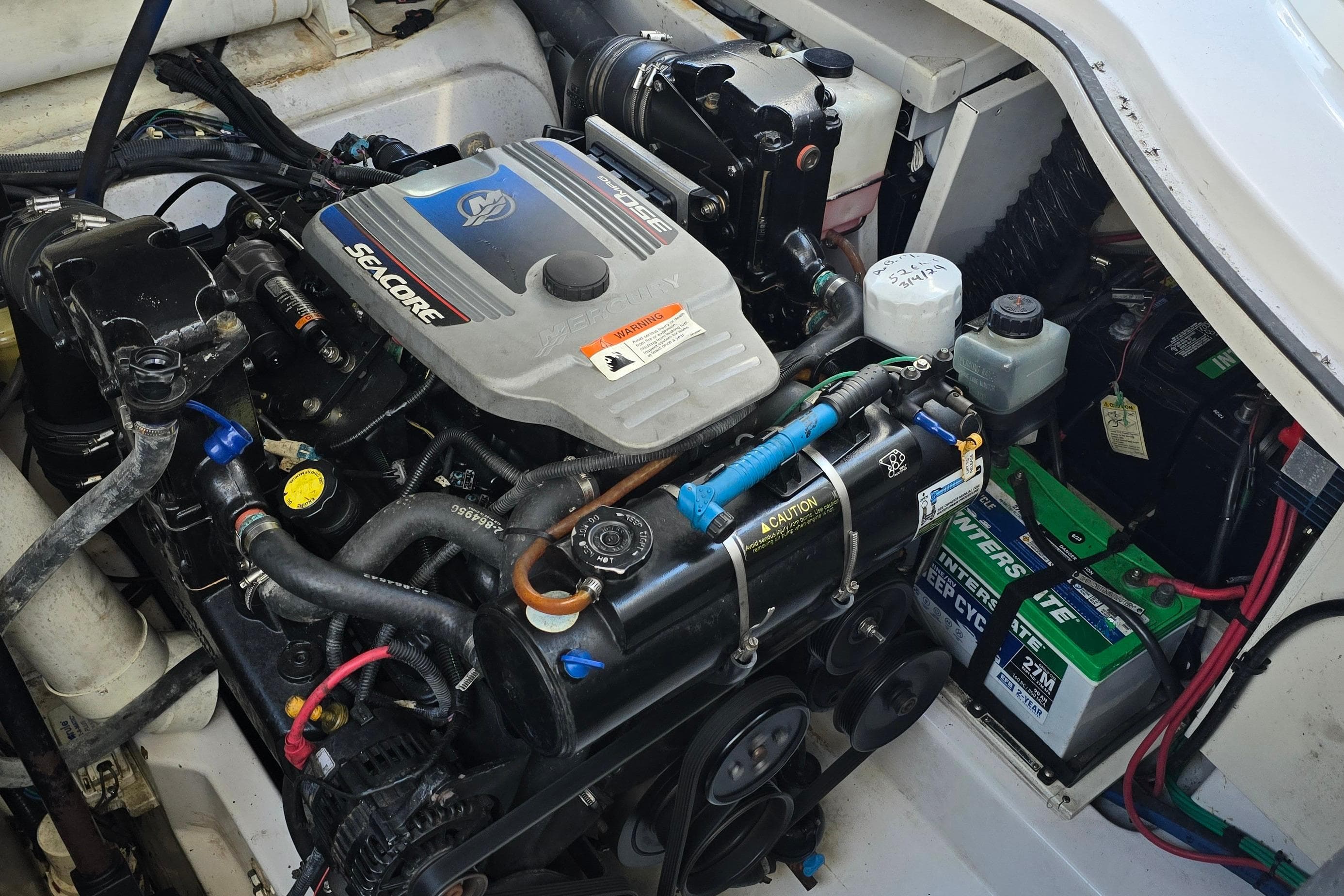 Engine compartment of a 2008 Four Winns V358 boat, featuring a Seacore engine.