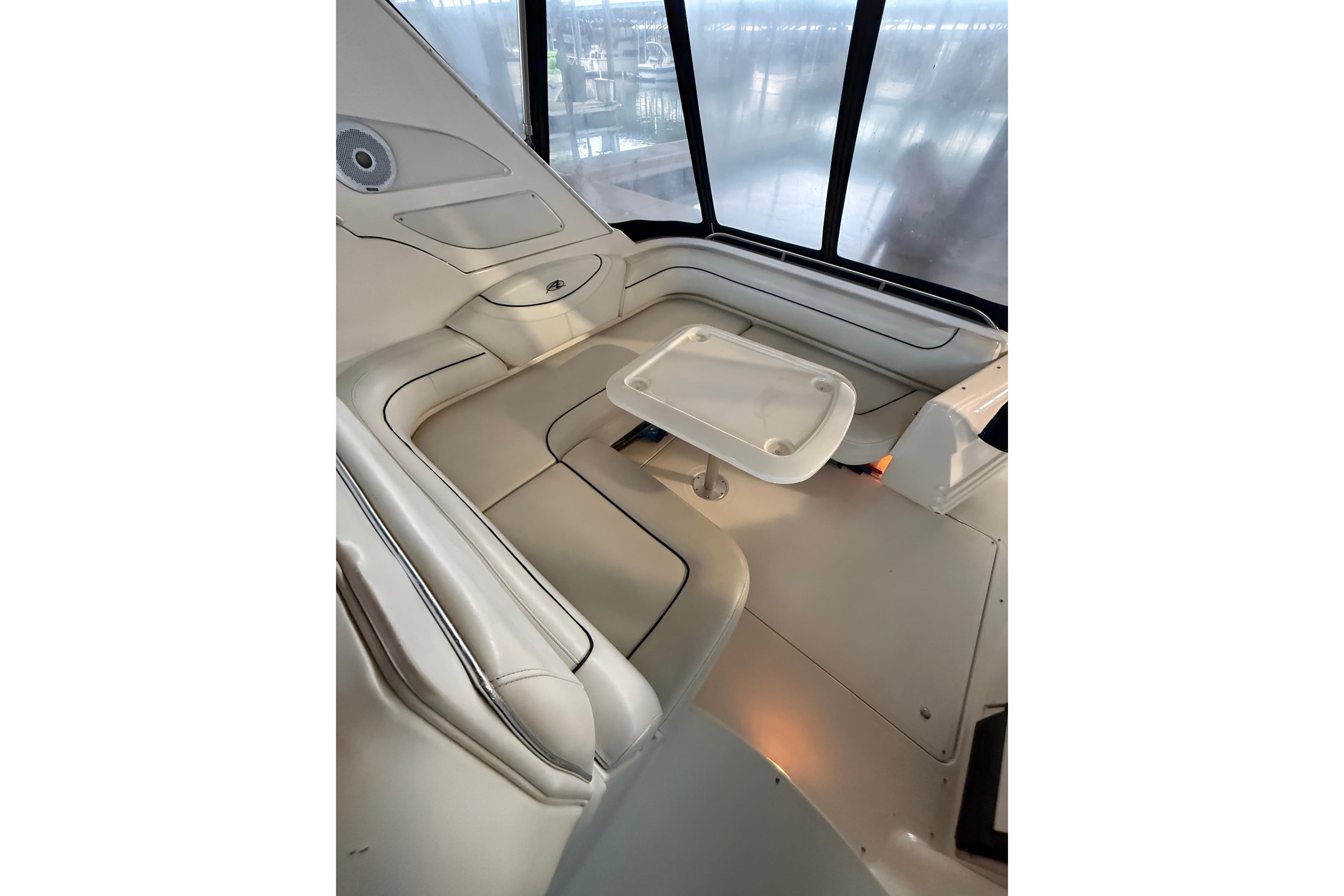 Interior of 1998 Bayliner 3685 Avanti Sunbridge with seating and table.