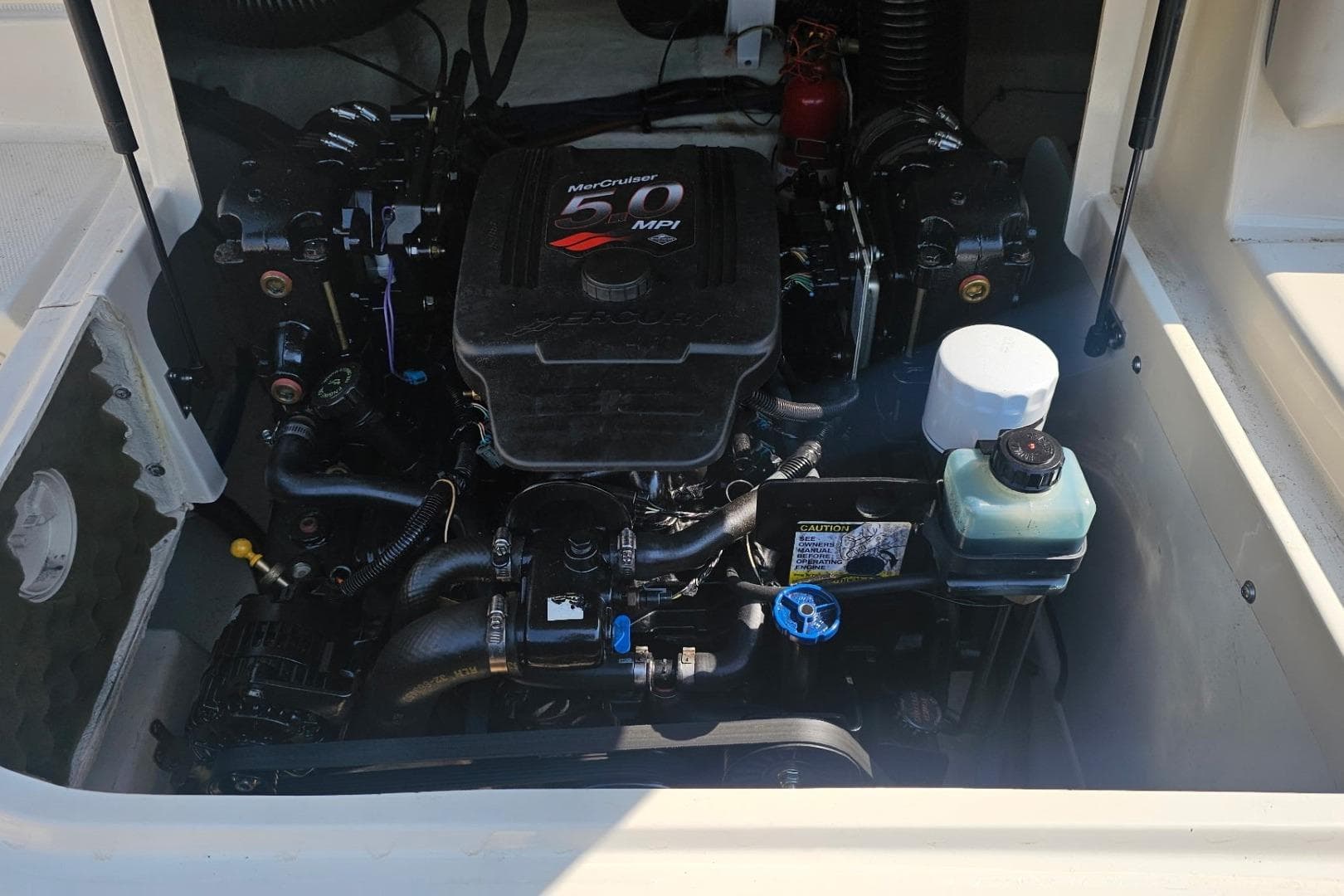 Engine compartment of a 2003 Sea Ray 220 Sundeck with MerCruiser 5.0 MPI engine.