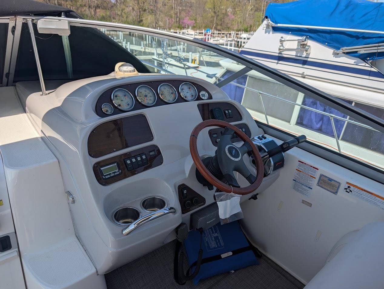 2006 Chaparral 310 Signature boat dashboard with gauges and steering wheel.