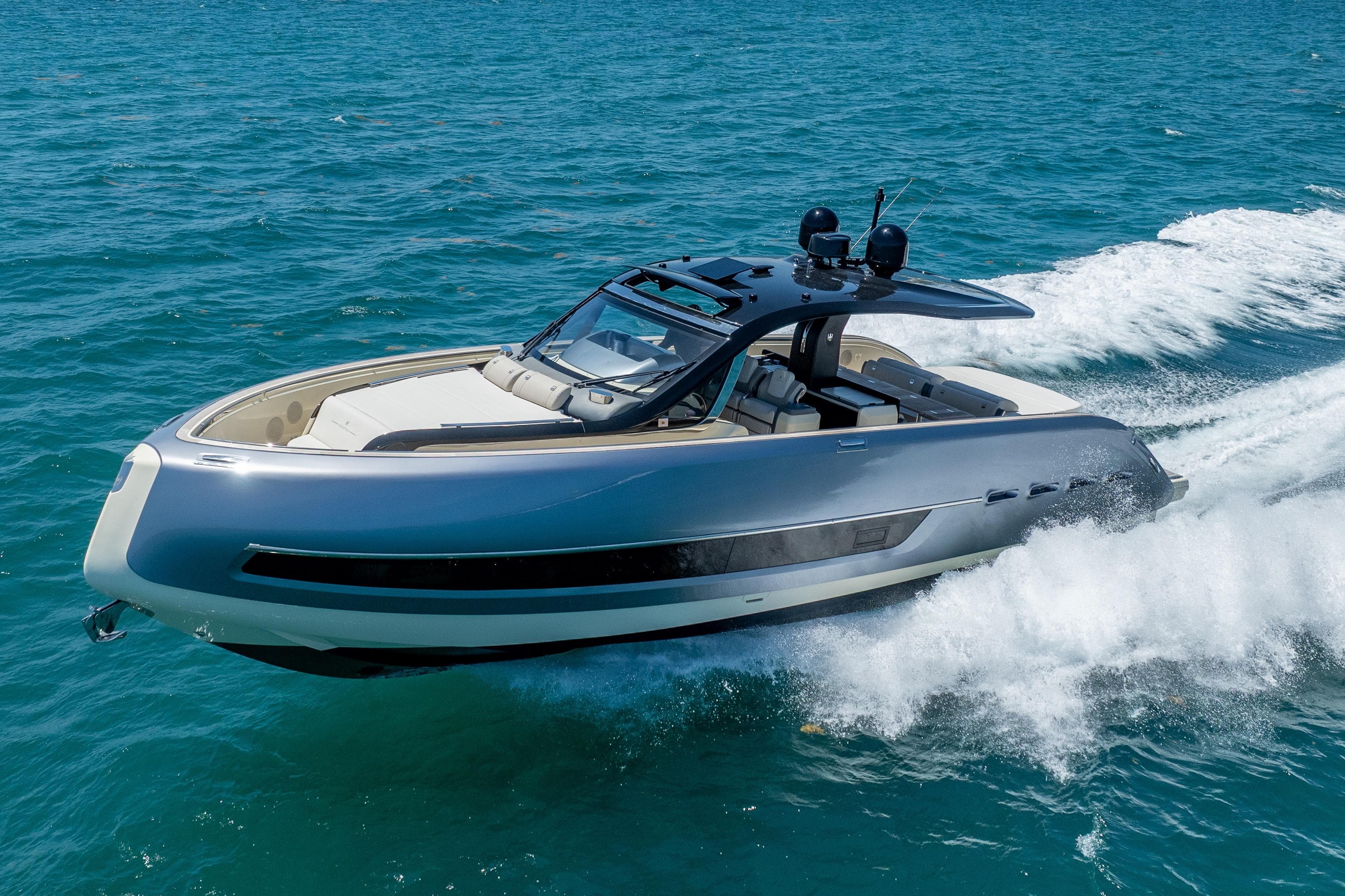 2024 Invictus TT460 luxury yacht cruising on open water.