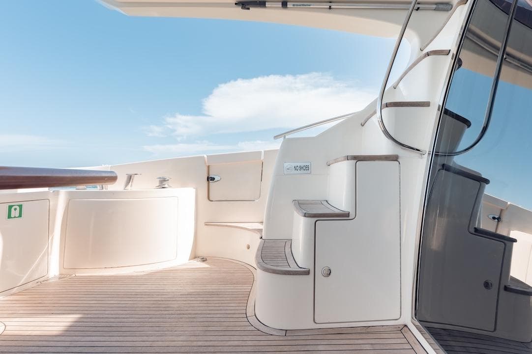 Luxurious Azimut 62 Evolution yacht deck with elegant wooden flooring, 2007 model.