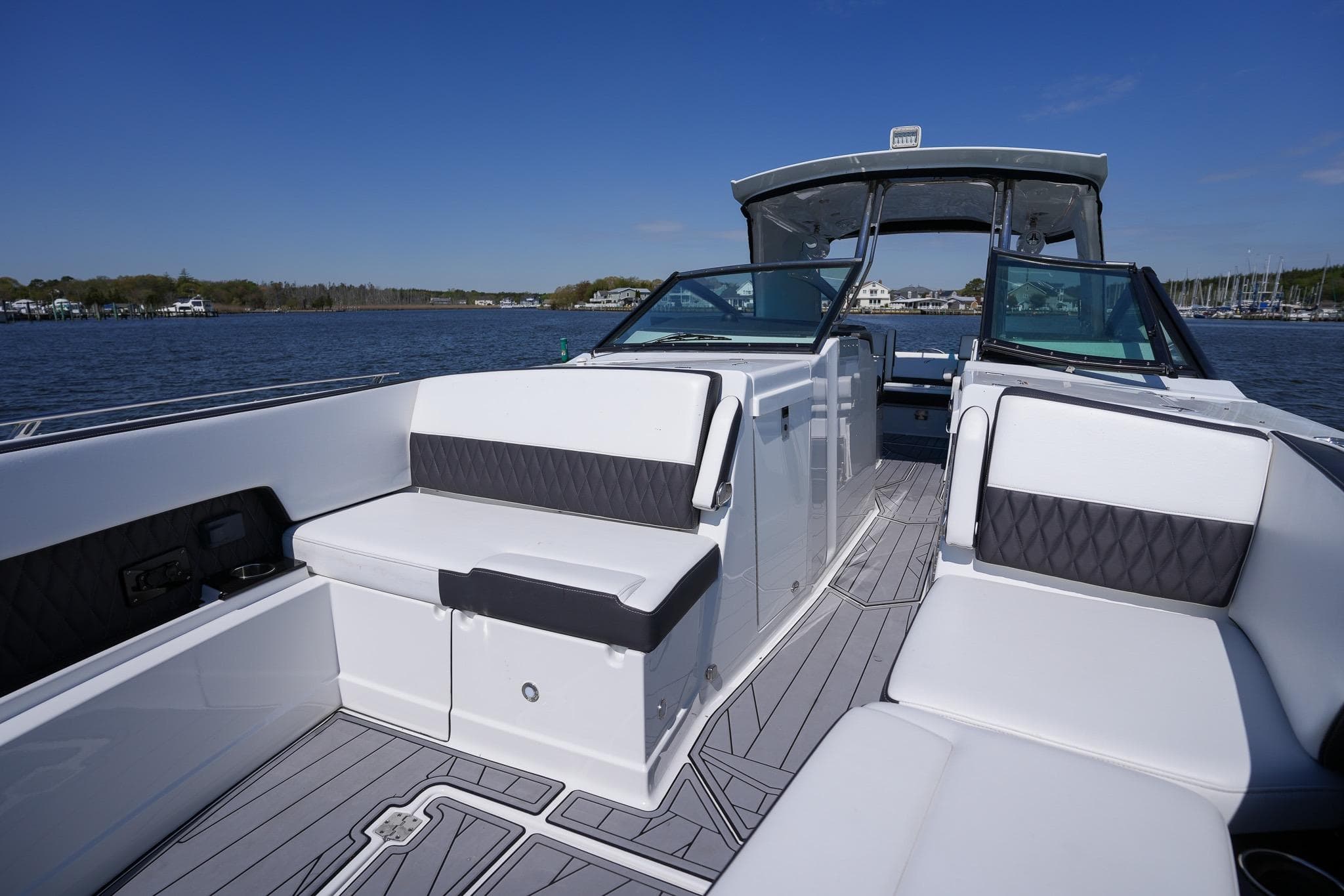 2021 Monterey 385SE Super Express boat interior with sleek seating and modern design on the water.