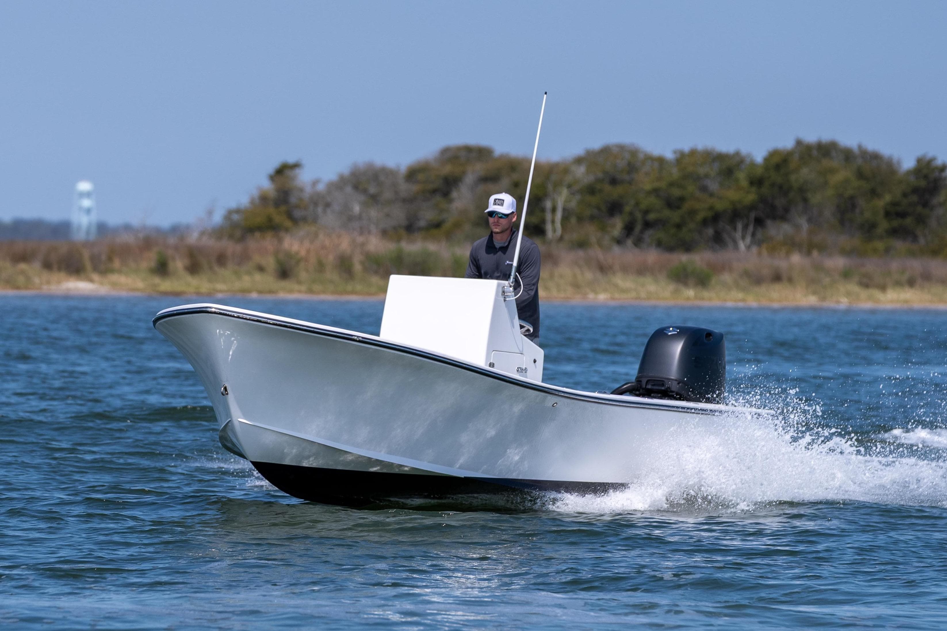 1979 Privateer 20 boat on water with driver.