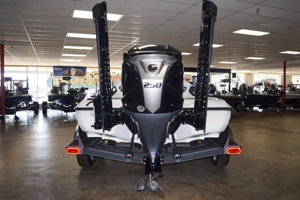 2026 Skeeter FXR20 FLEX boat in showroom, rear view with powerful engine.