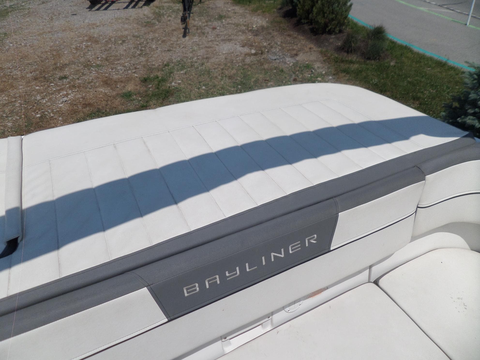 2017 Bayliner VR6 Bowrider I/O boat with white seating and Bayliner logo.