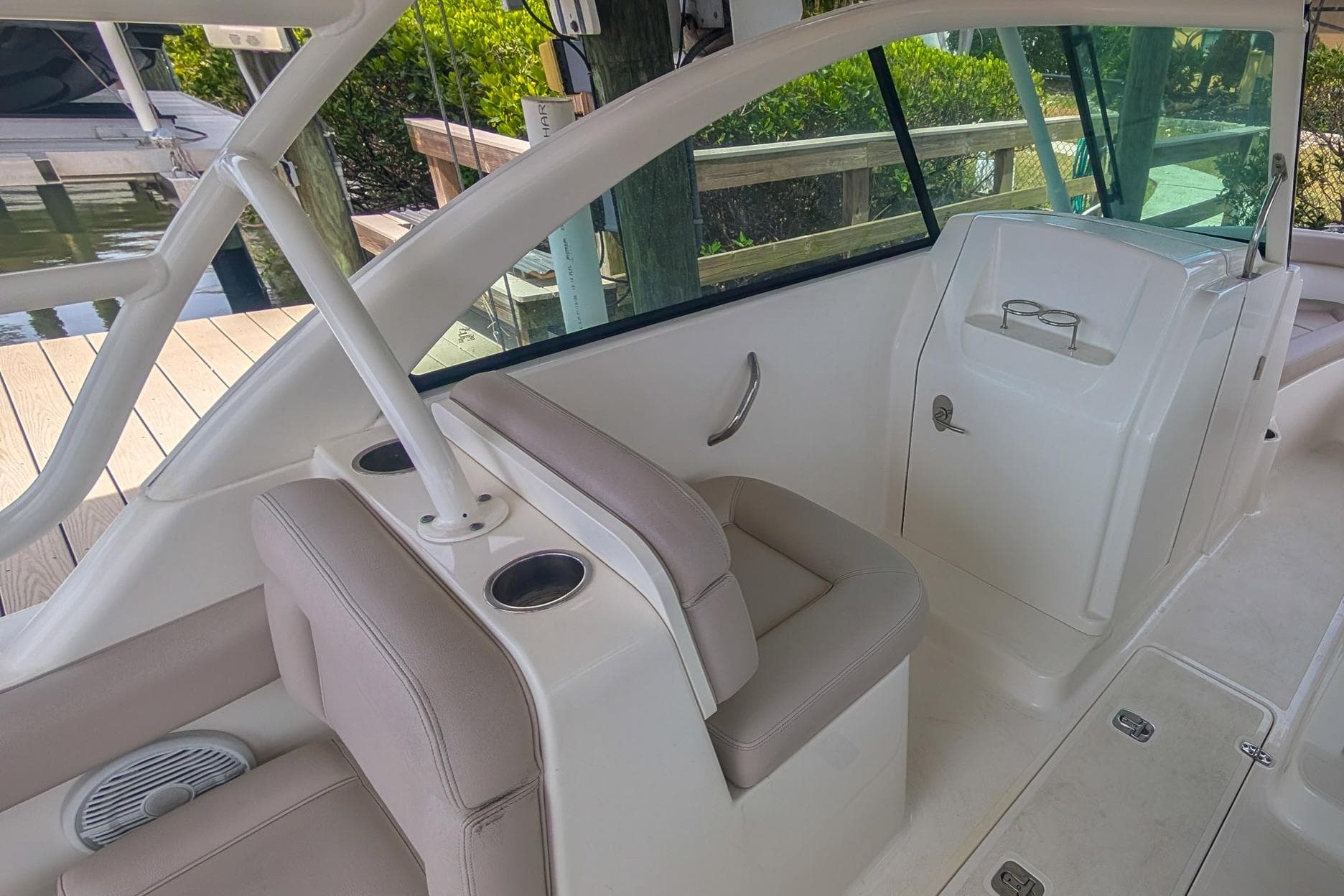 2015 Pursuit DC 265 Dual Console boat interior with seating and cup holders.