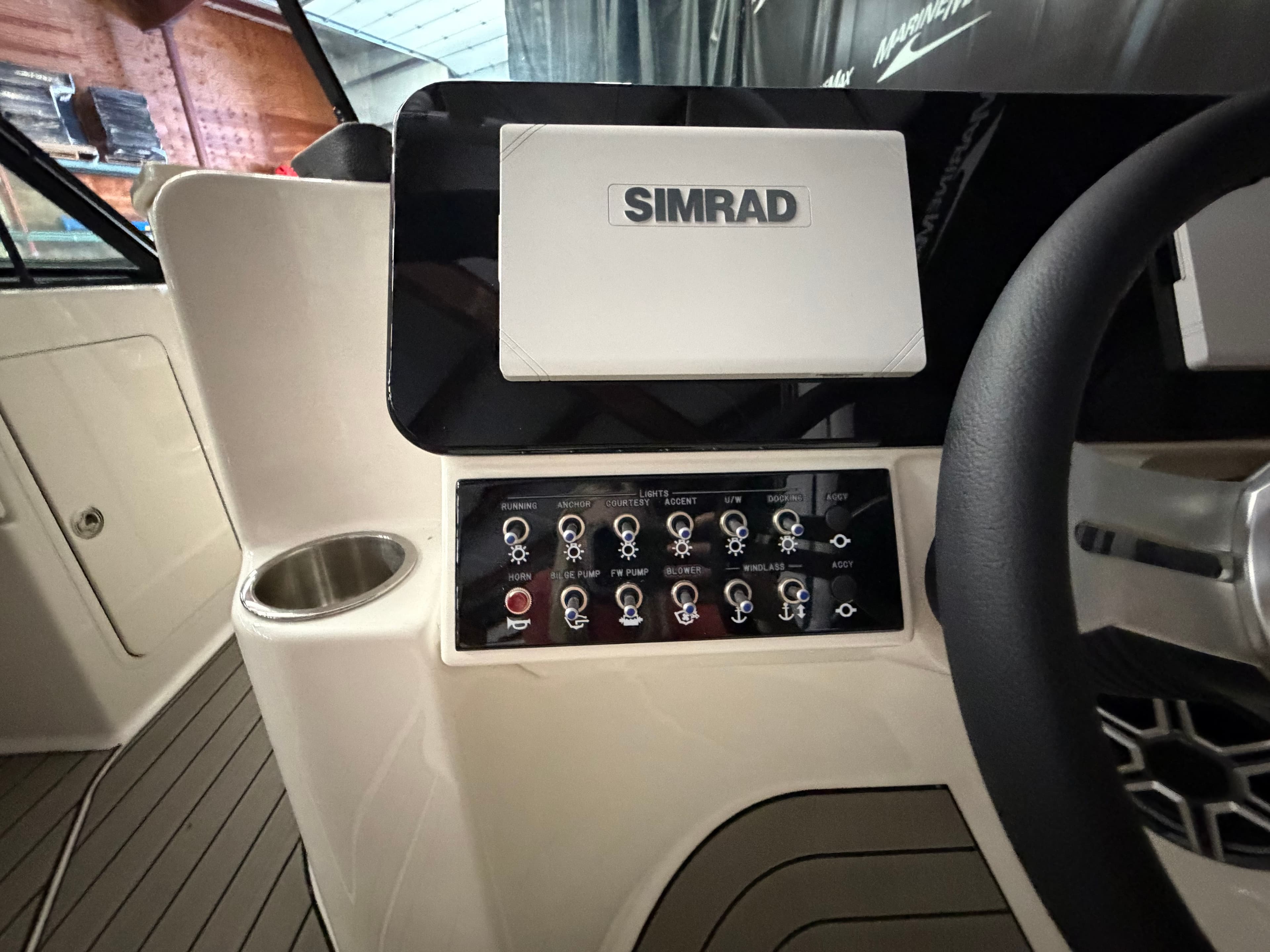 Sea Ray SDX 270 Surf 2026 helm with Simrad system.