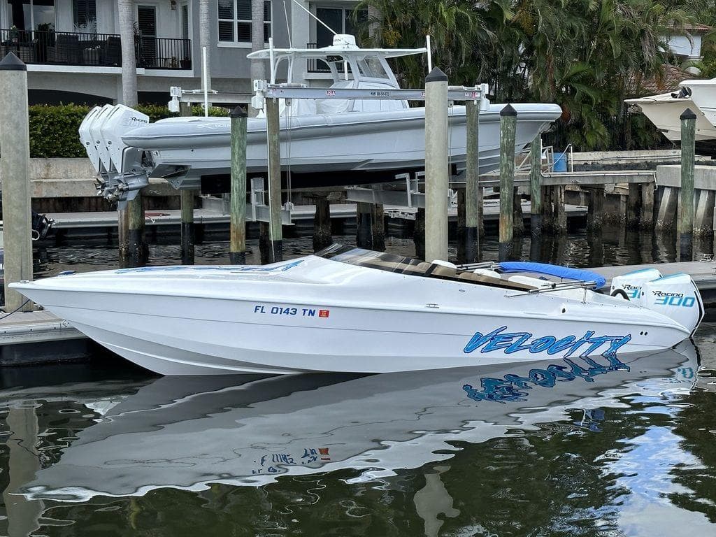 2024 Velocity 290sc speedboat docked in marina.