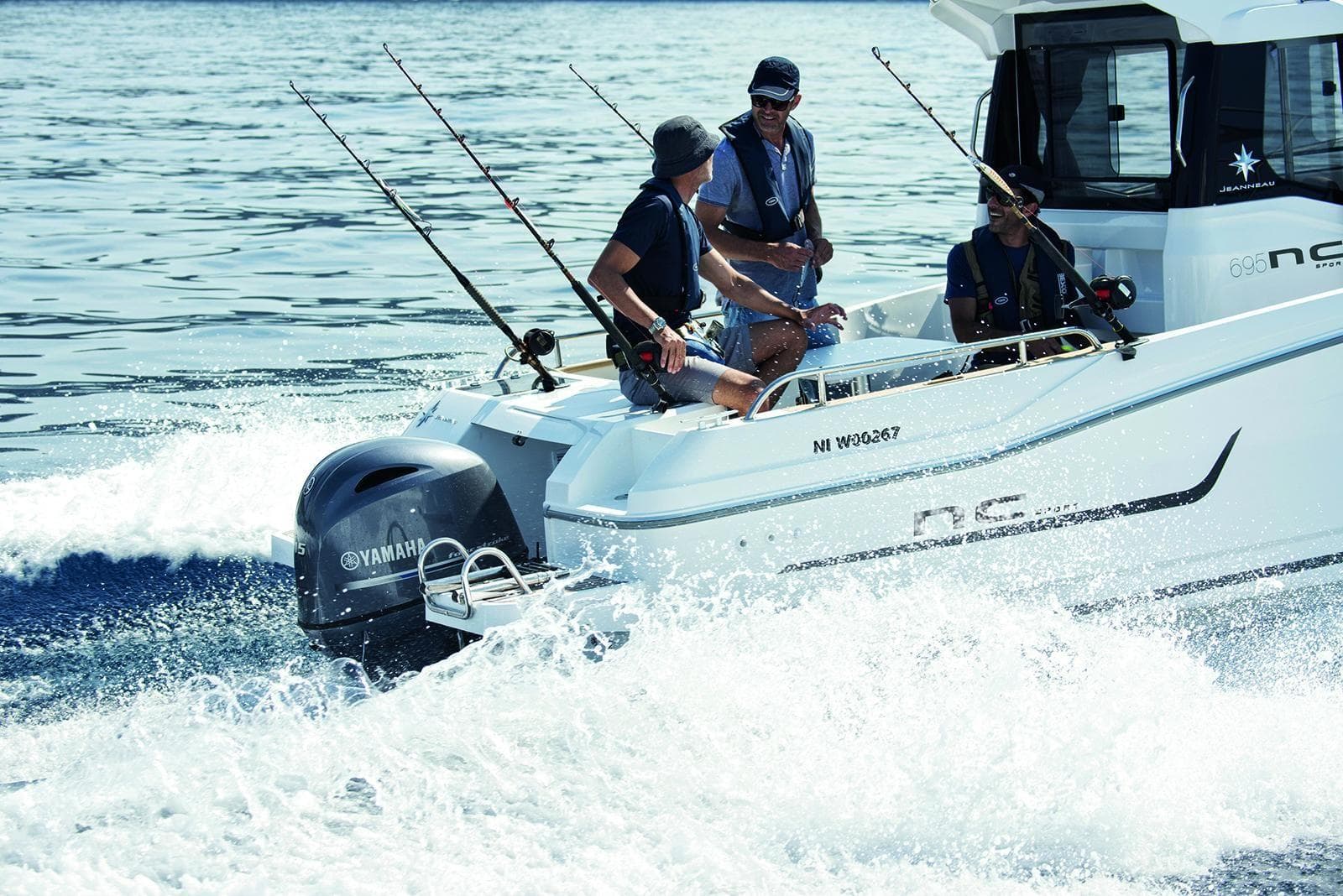 2024 Jeanneau NC 695 Sport boat with people fishing, Yamaha engine, on the water.