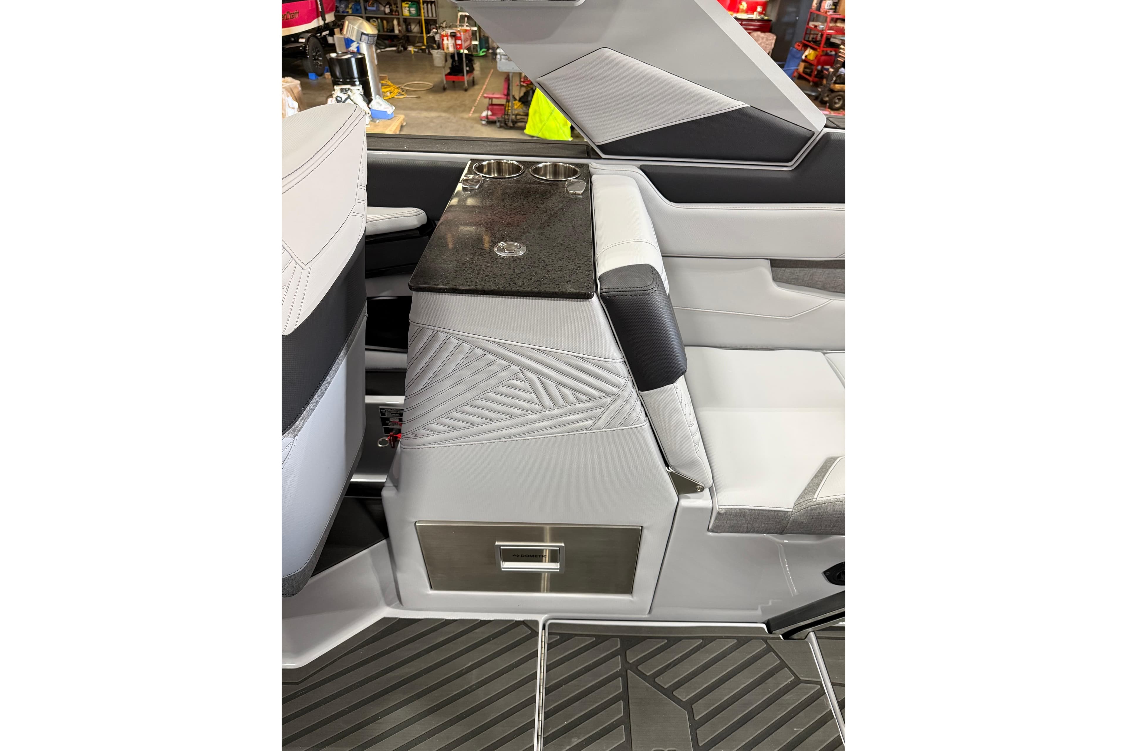 Interior of 2026 MasterCraft XStar 25 boat with sleek seating and storage.