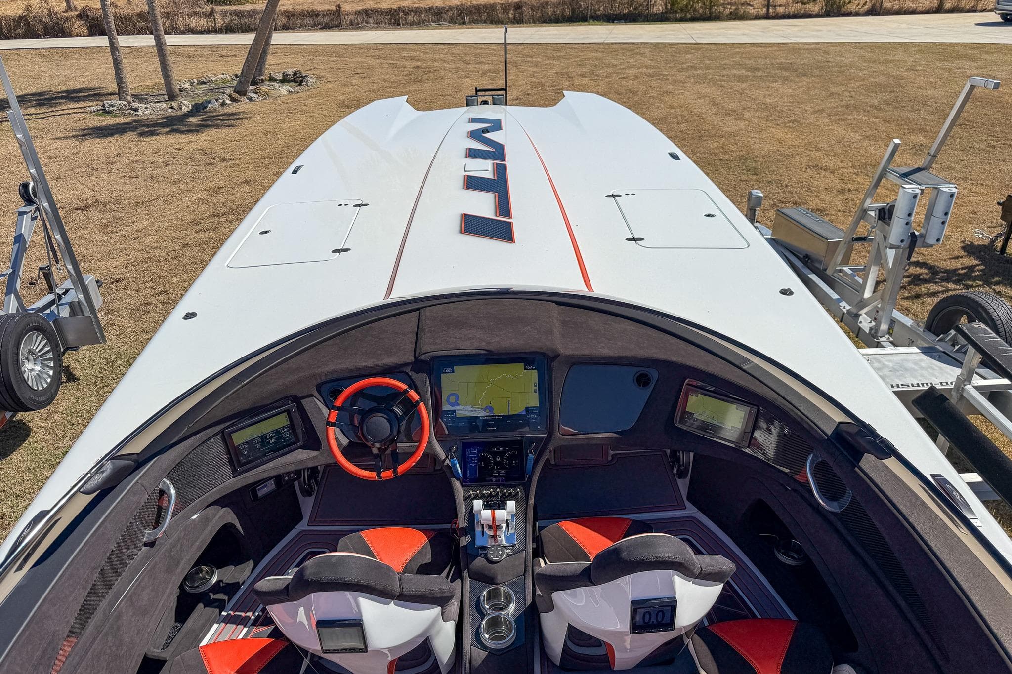 Cockpit view of 2021 MTI 390X boat with advanced navigation system and sporty design.