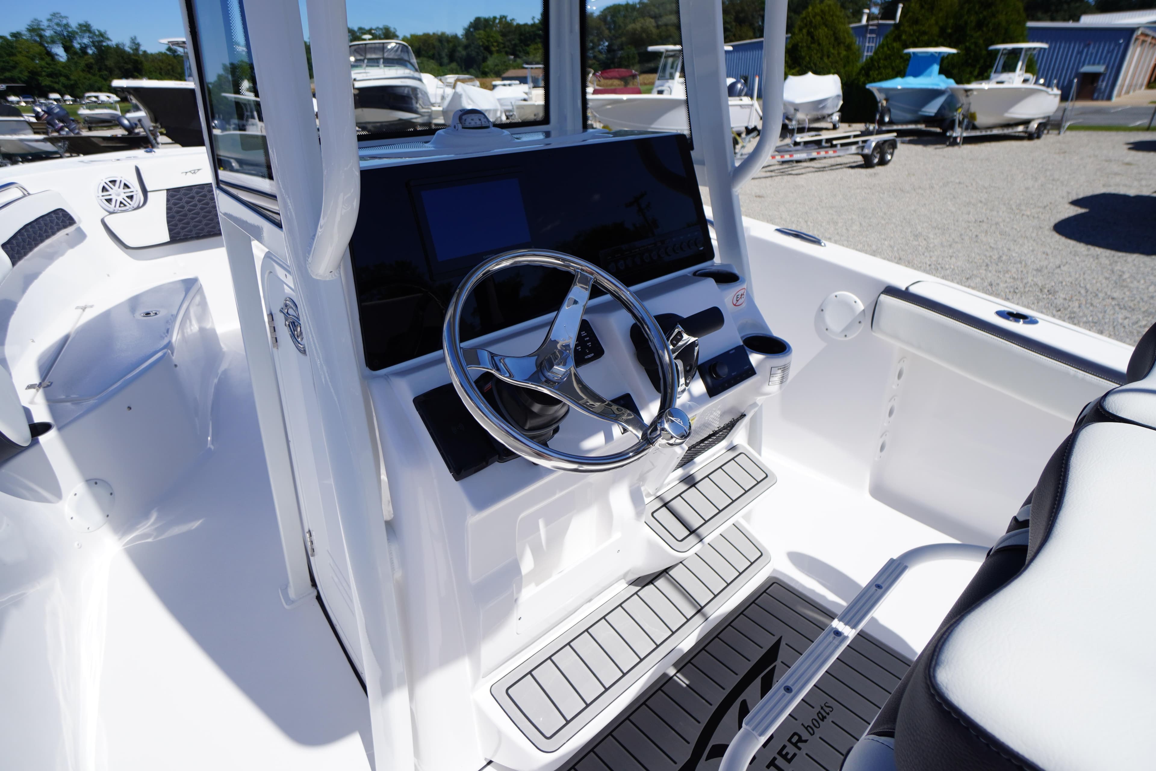 2026 Tidewater 220 CC Adventure boat cockpit with modern steering and controls.