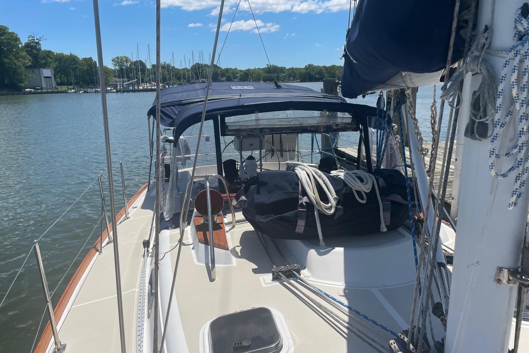 Sailboat Tartan 3700, 2001 model, docked on a sunny day with clear skies.