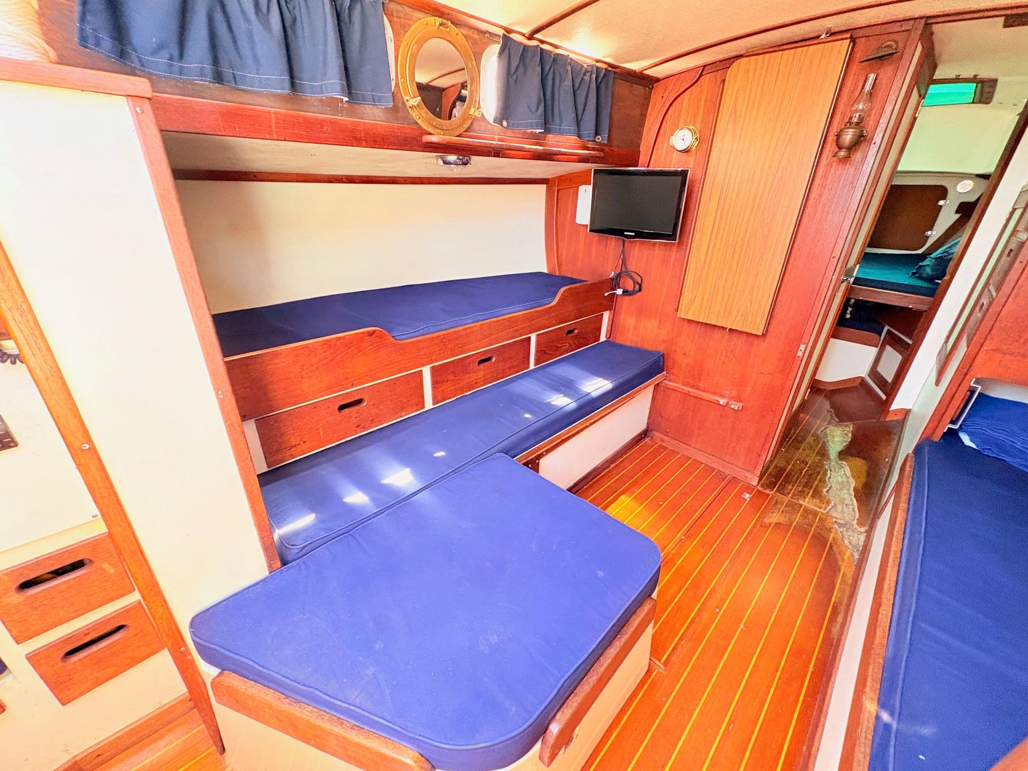 Interior of a 1972 Tartan 34 Classic yacht with wooden furnishings.