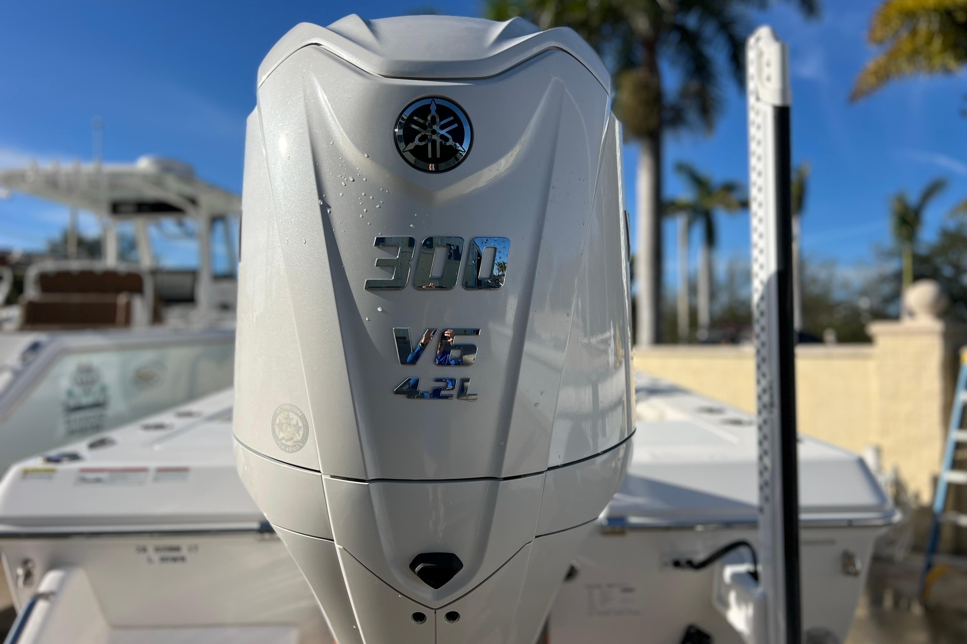 2024 Everglades 243 Center Console with 300 V6 4.2L engine, outdoor setting.