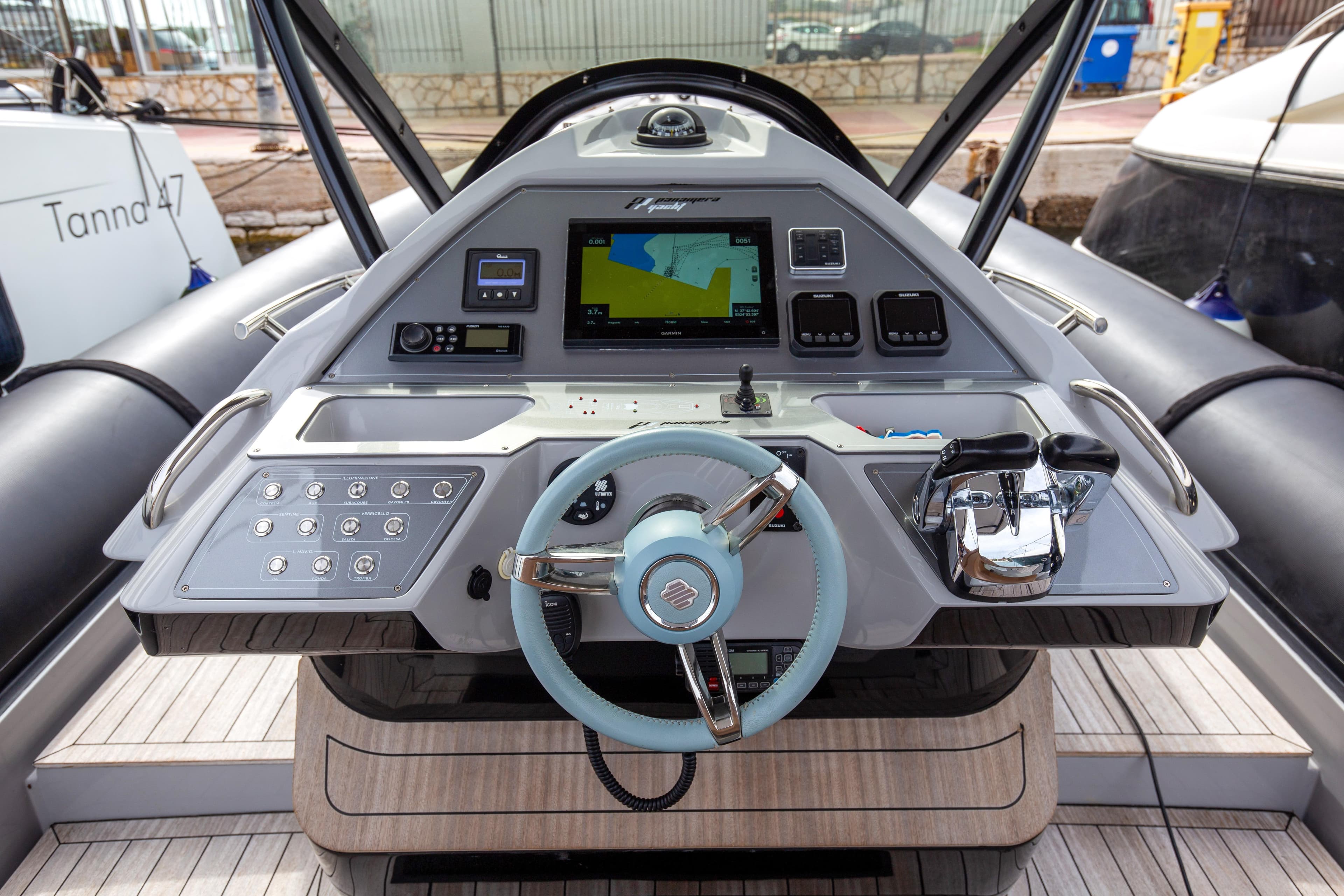 Control panel of 2021 Panamera Yacht PY100 with steering wheel and navigation display.