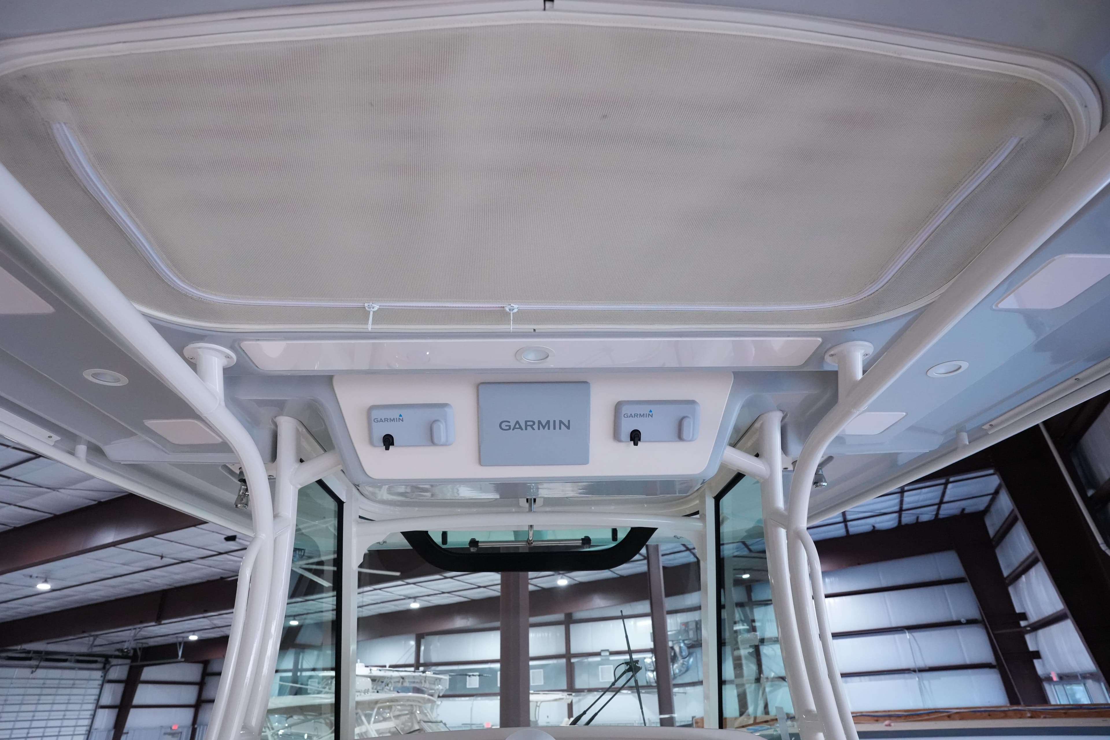 2023 Grady-White Canyon 336 boat with Garmin electronics in a spacious interior setting.