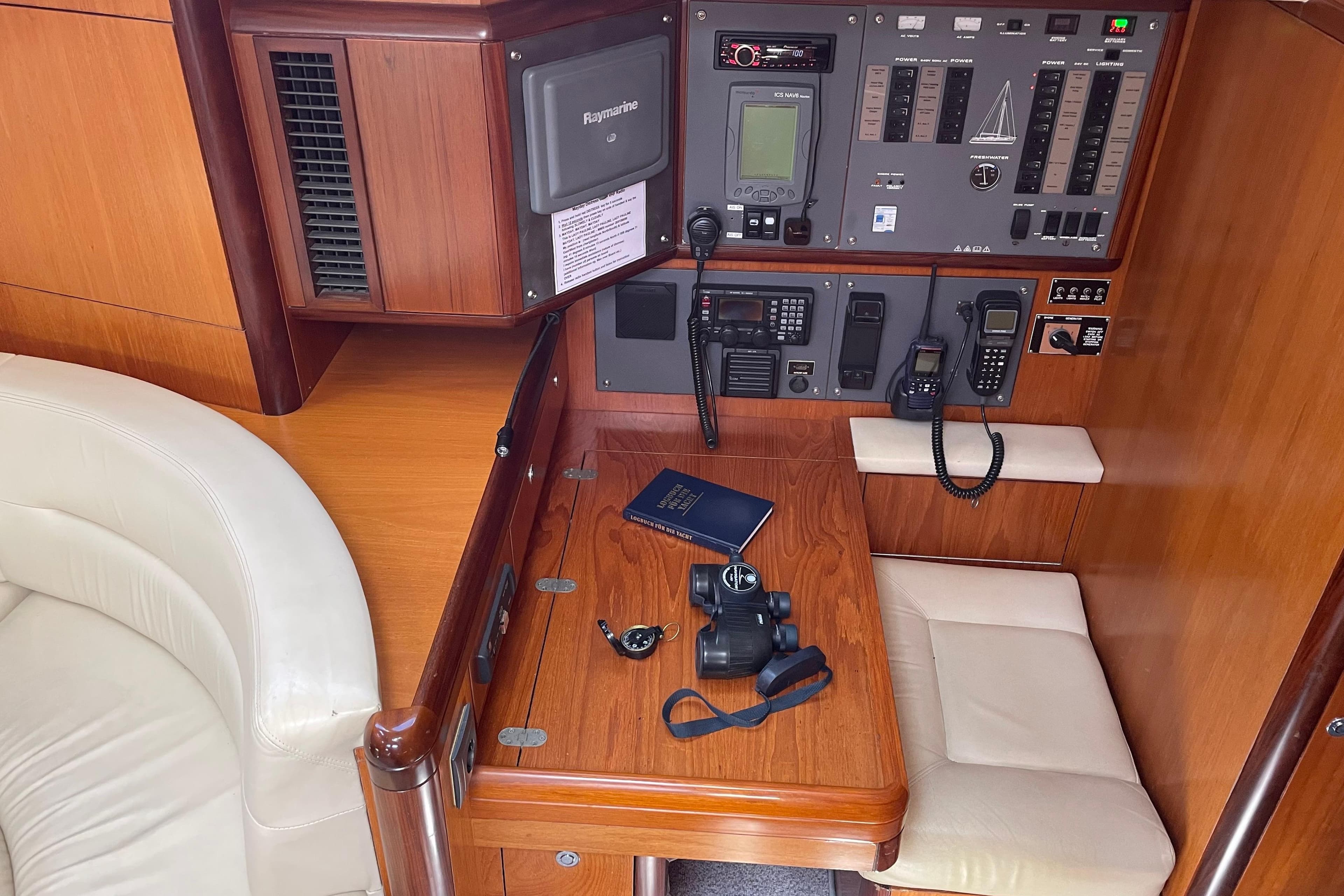 Navigation station in a 2004 Moody 56 yacht with control panel and equipment.