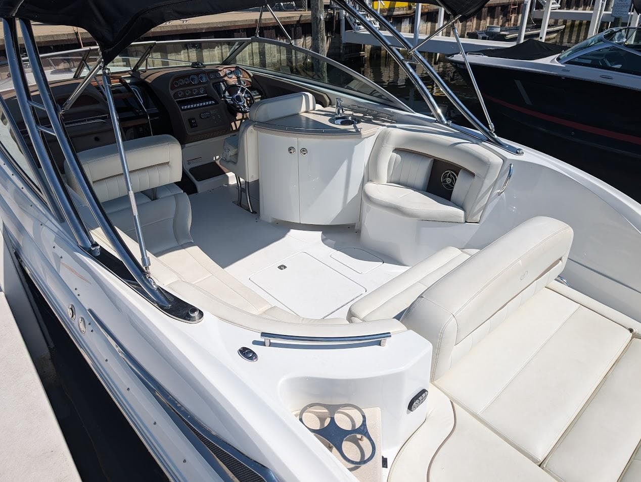 2007 Cobalt 323 boat interior with white seating and modern dashboard.