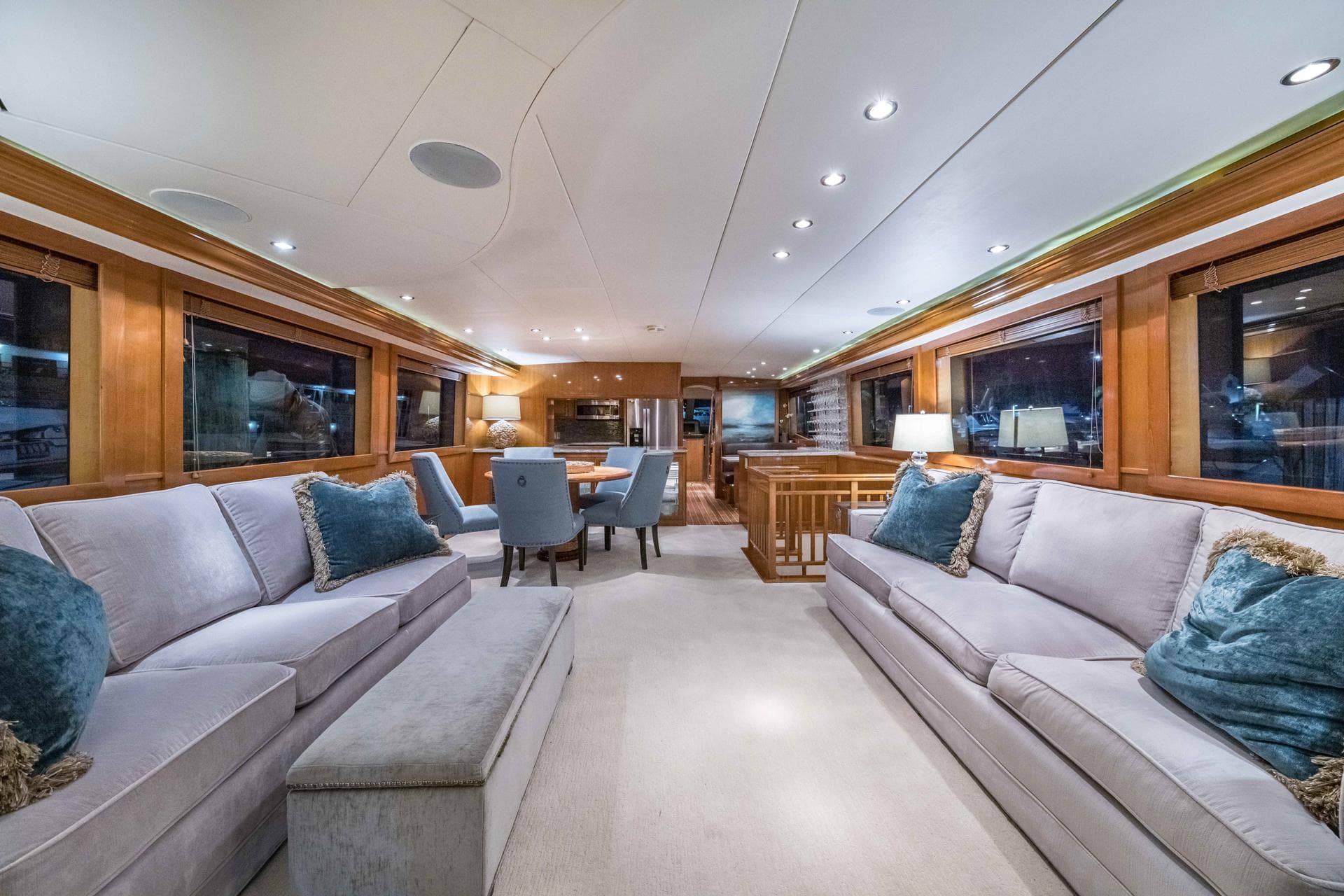 Luxurious interior of a 2002 Hatteras Motor Yacht with elegant seating and dining area.