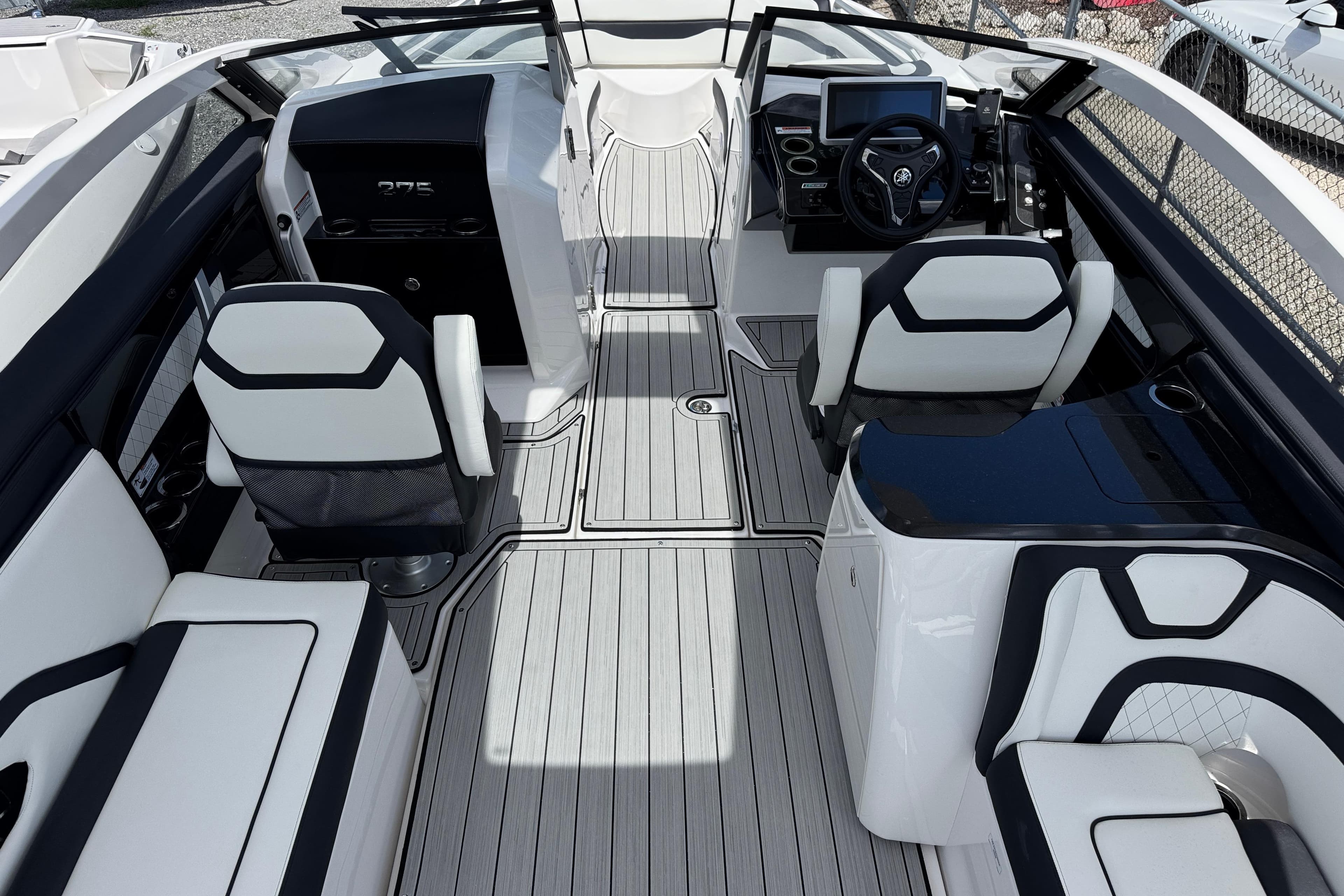 2026 Yamaha Boats 275SD interior with sleek seating and modern dashboard design.