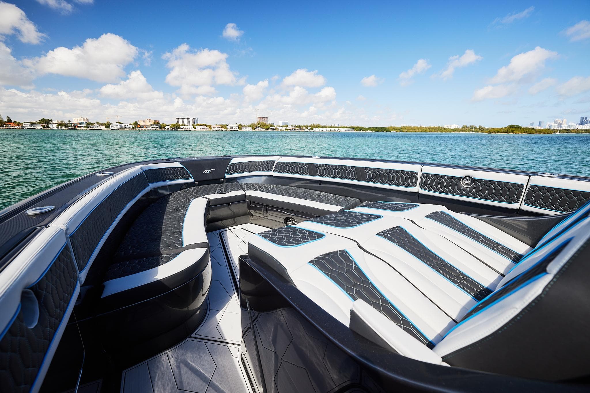 2023 Midnight Express 43' Solstice boat interior with luxurious seating on a sunny day.