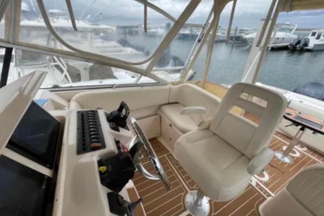 Interior of a 2007 Grady-White Express 330 boat with helm and seating area.