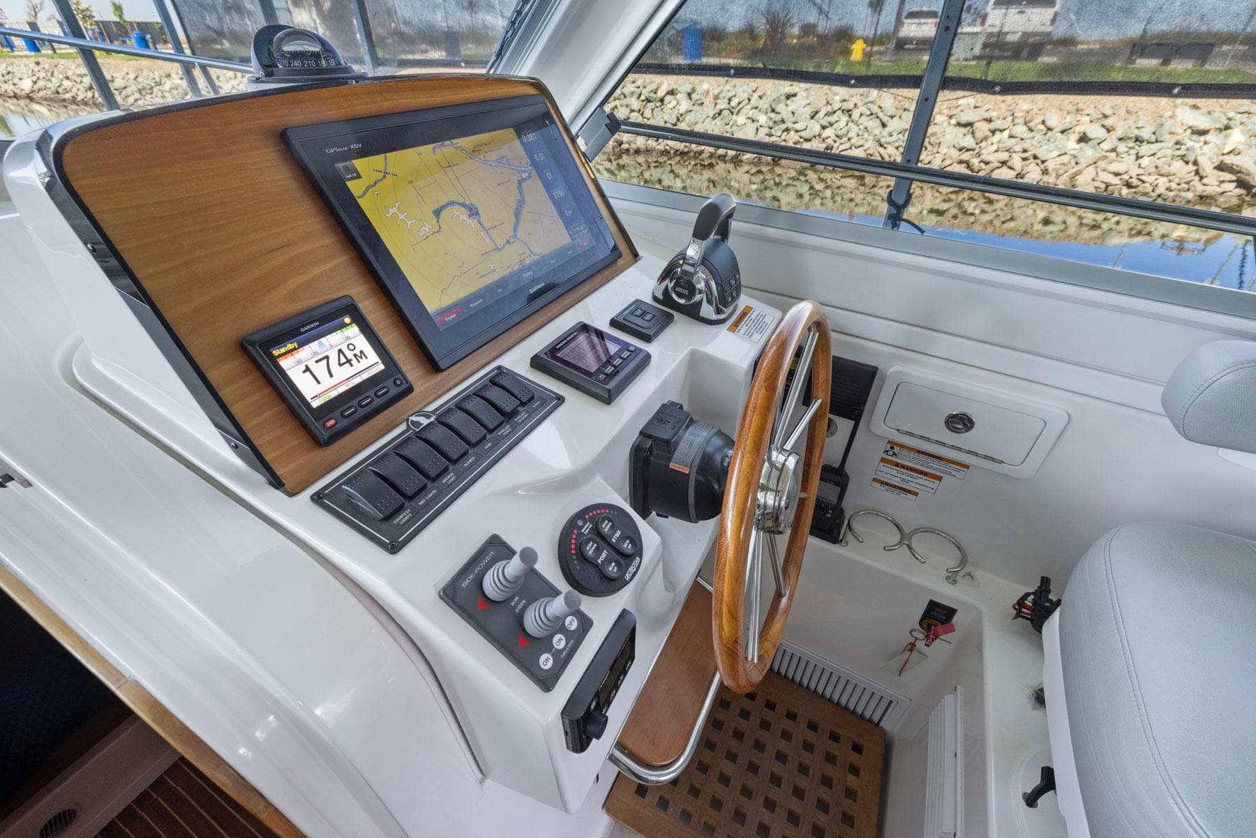 Helm of 2018 Back Cove 32 boat with navigation screens and controls.