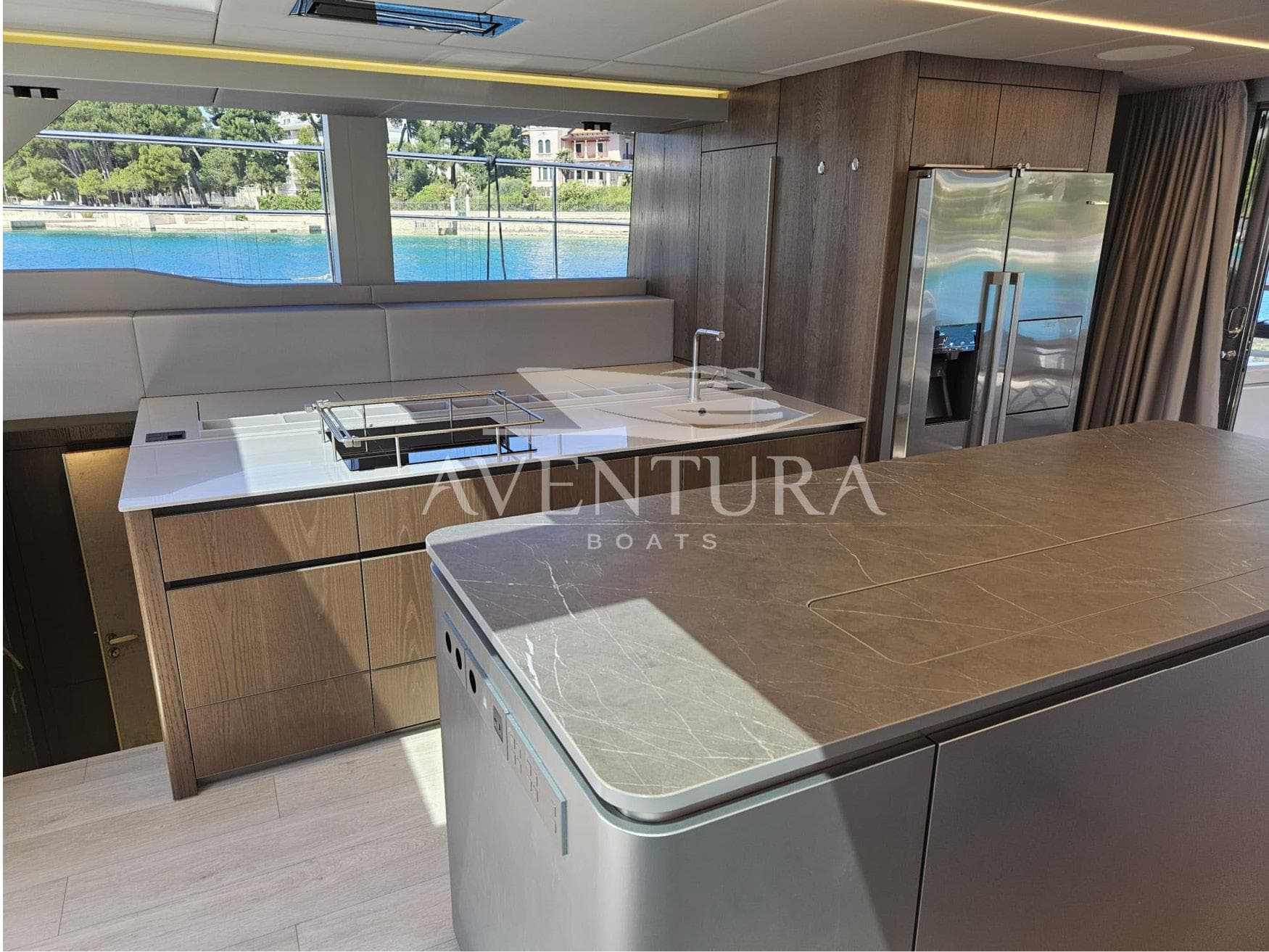 Luxurious kitchen interior of 2021 Sunreef 60 Power yacht with modern appliances and sleek design.