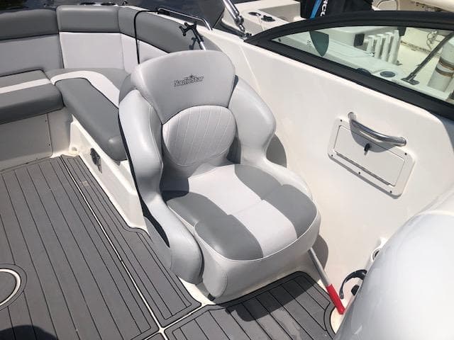 2022 NauticStar 243 DC boat interior with gray seating and sleek design.