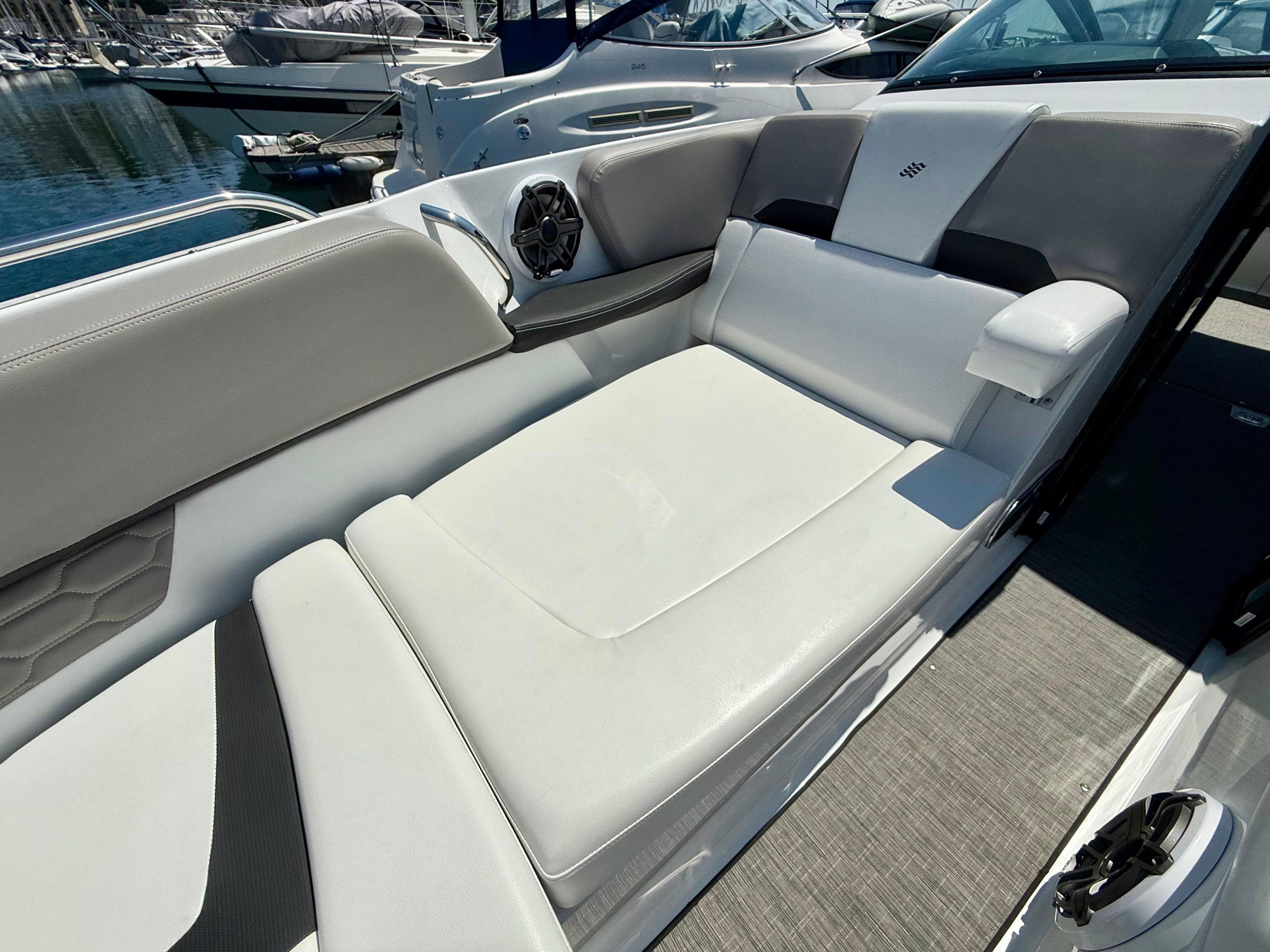 2023 Four Winns H290 boat interior with luxurious seating and modern design.