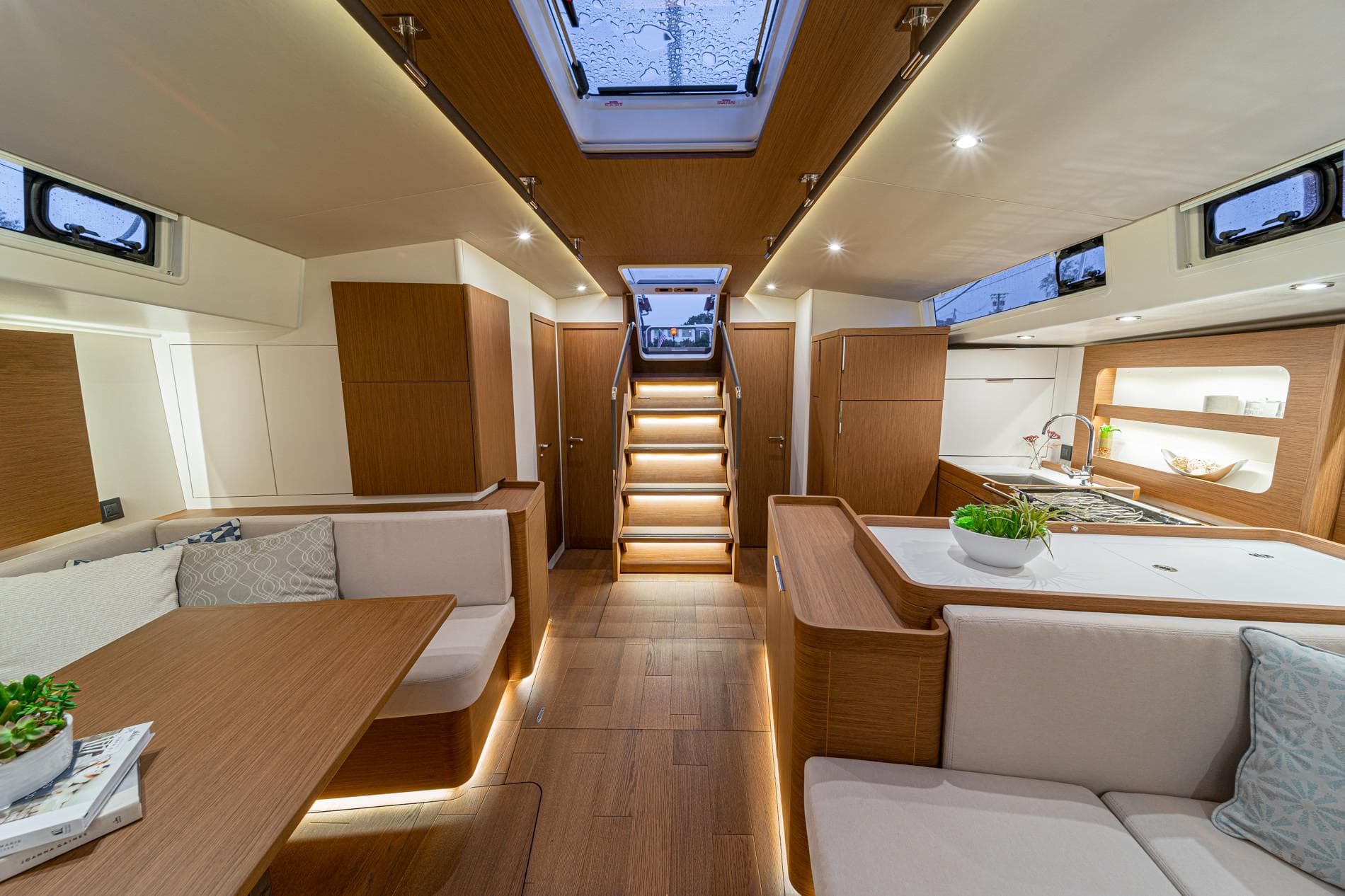 Luxurious interior of the 2025 Beneteau Oceanis Yacht 54 with modern design and ambient lighting.