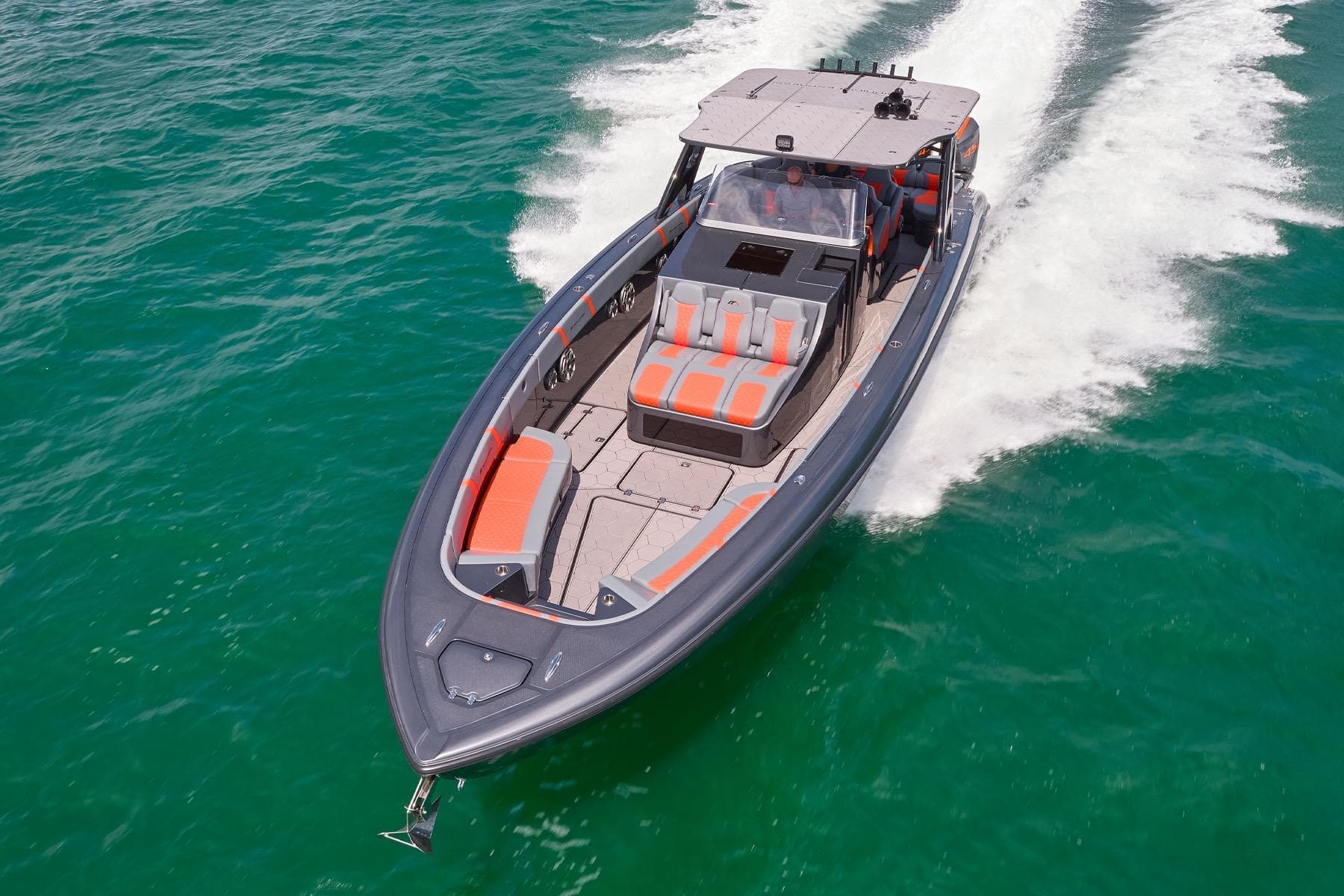 2022 Midnight Express 43 Open boat cruising on clear turquoise water.