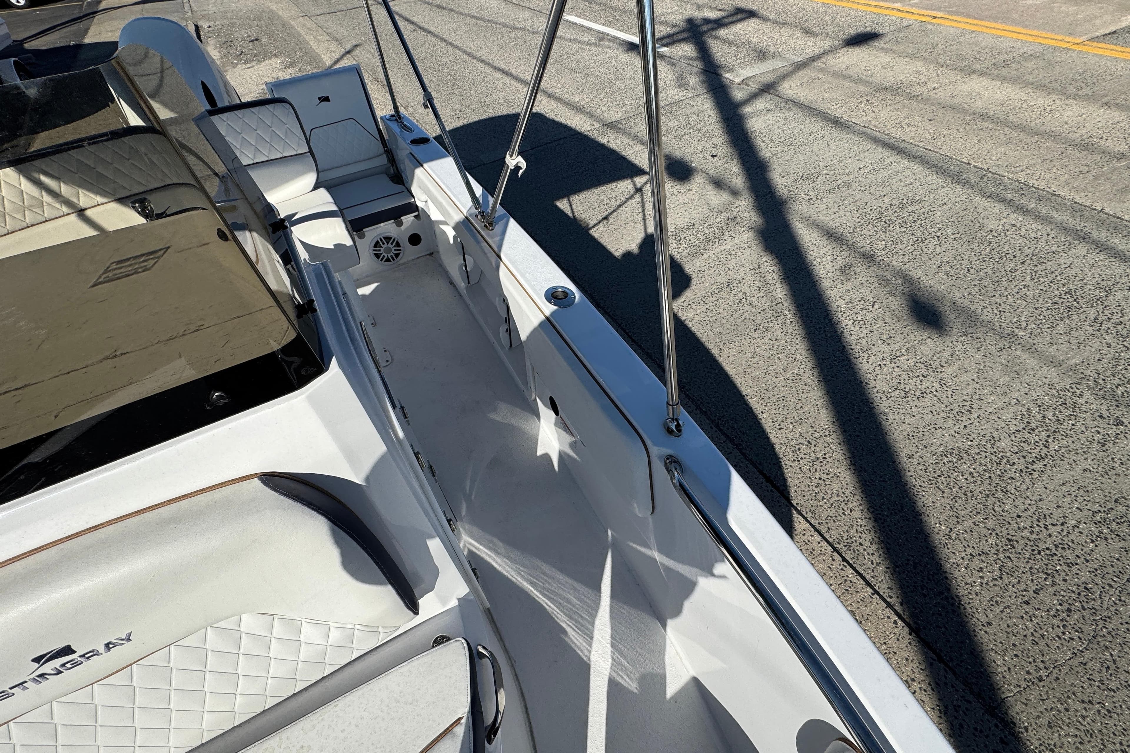 2025 Stingray 173 CC boat interior with white seating and sleek design.