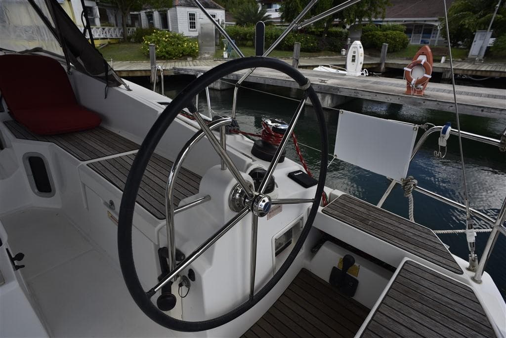 Steering wheel of 2013 Jeanneau Sun Odyssey 41 DS at dock.