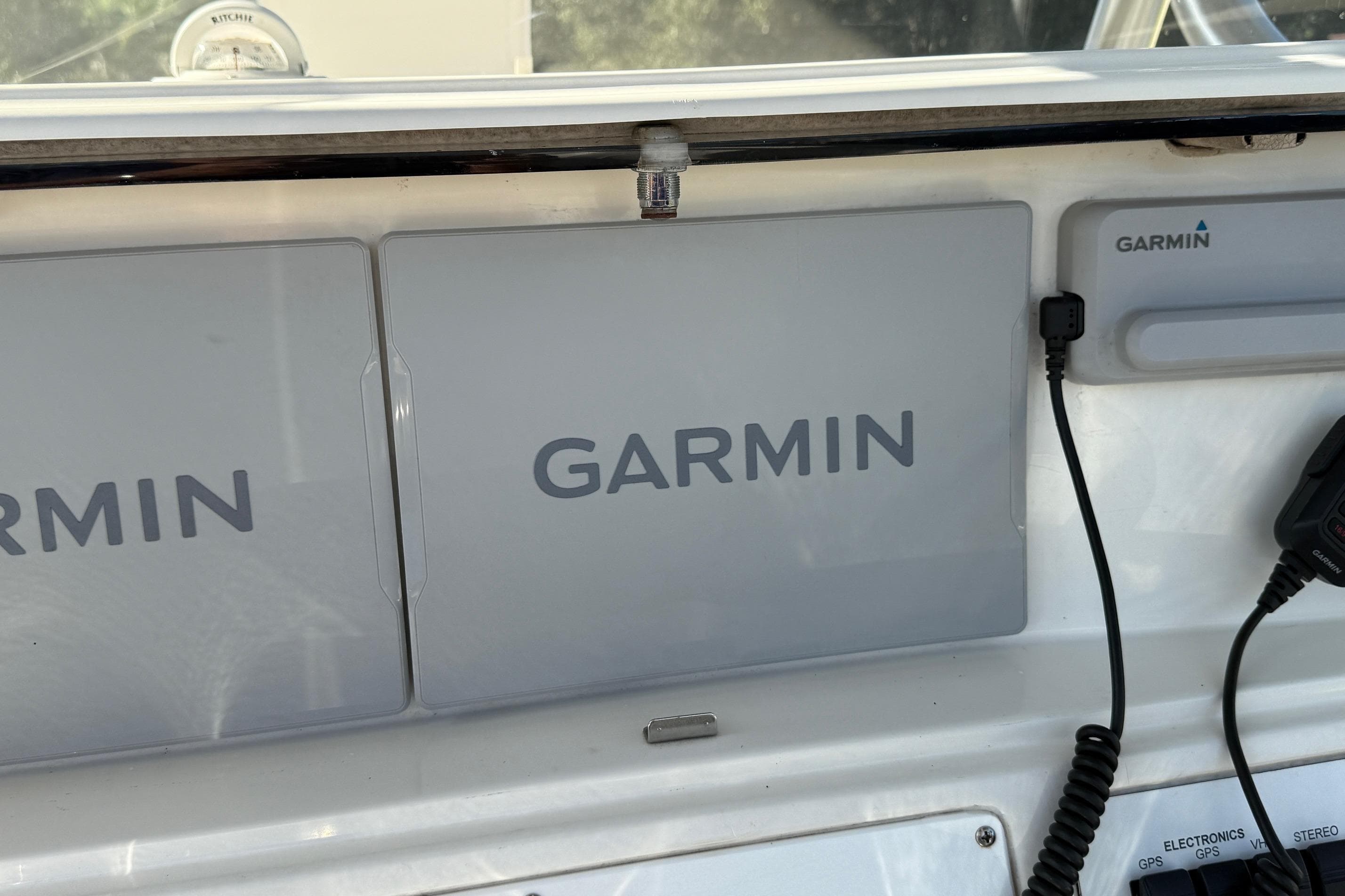 Garmin navigation system on 2001 Marlago 35 Cuddy boat dashboard.