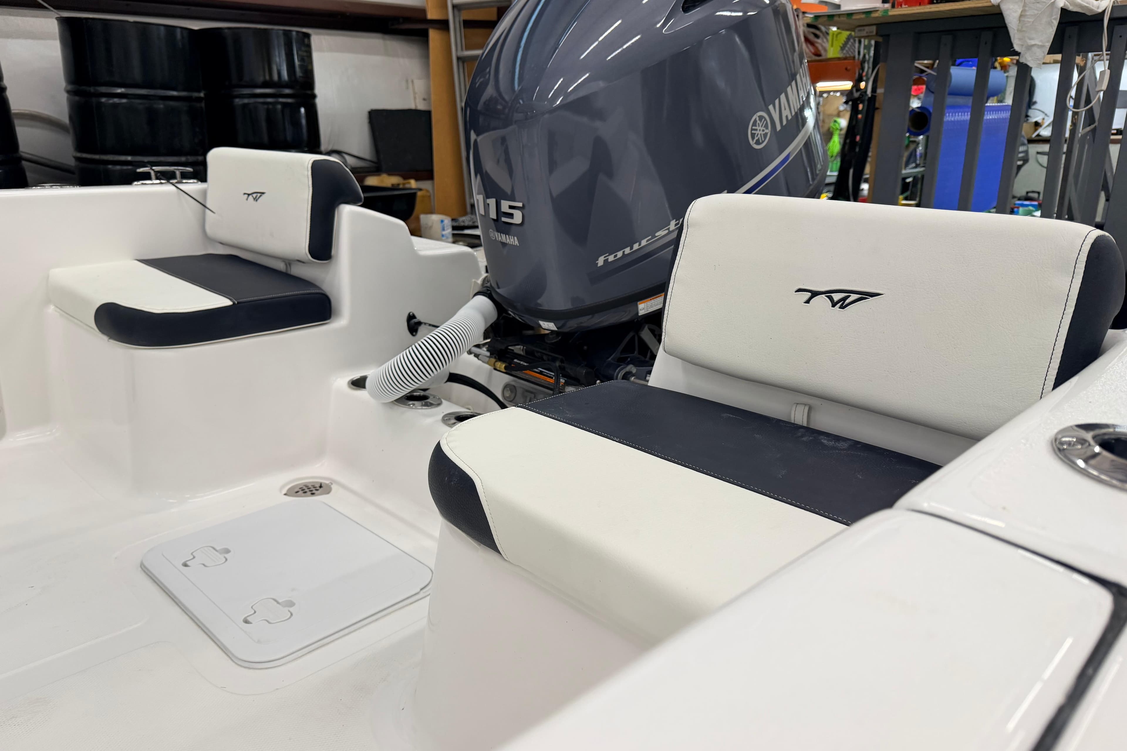 2026 Tidewater 180 CC Adventure boat interior with Yamaha engine, featuring cushioned seating.