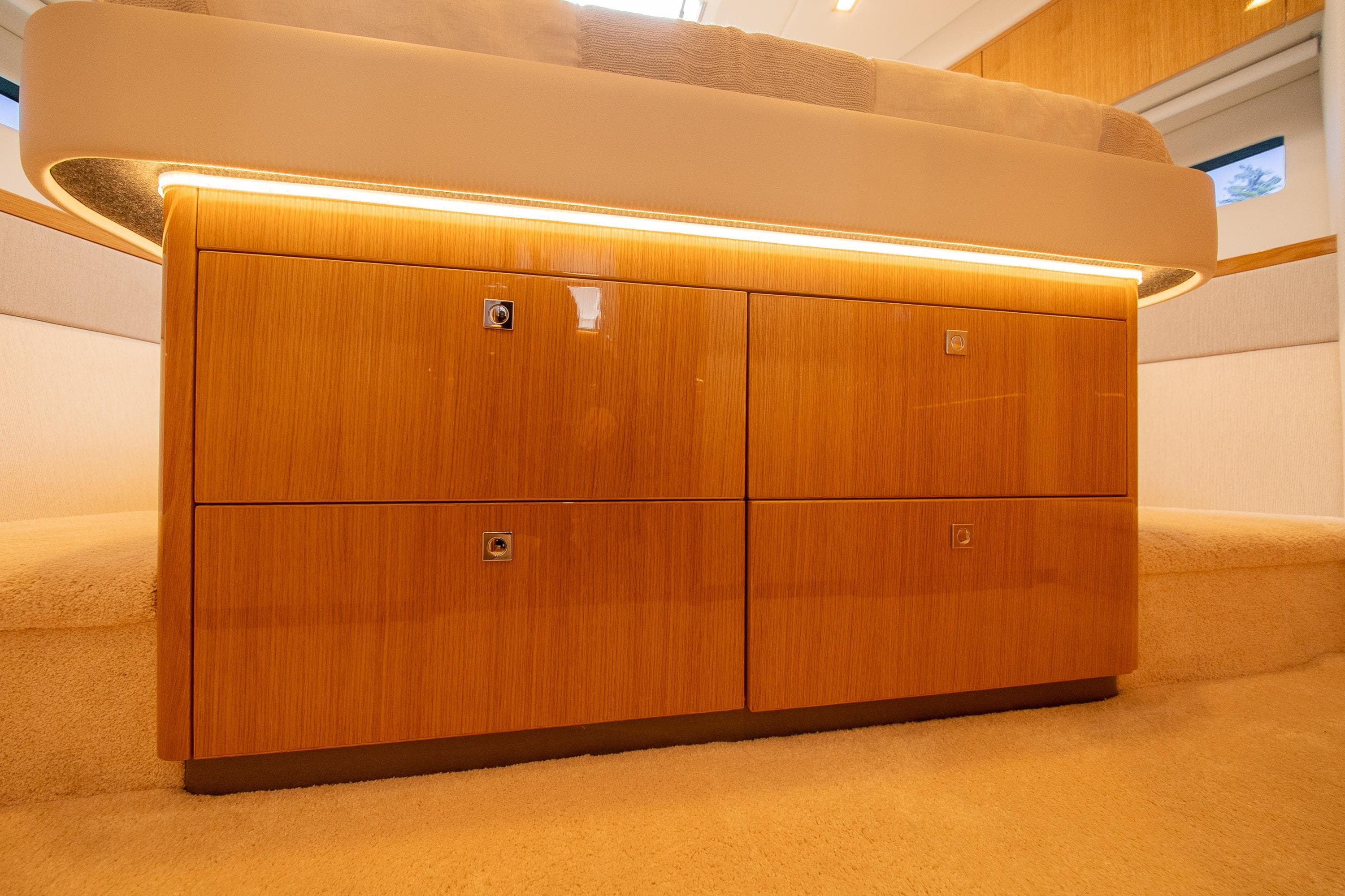 Luxurious wooden cabinetry in 2026 Riviera 4600 Sport Yacht Platinum Edition interior.