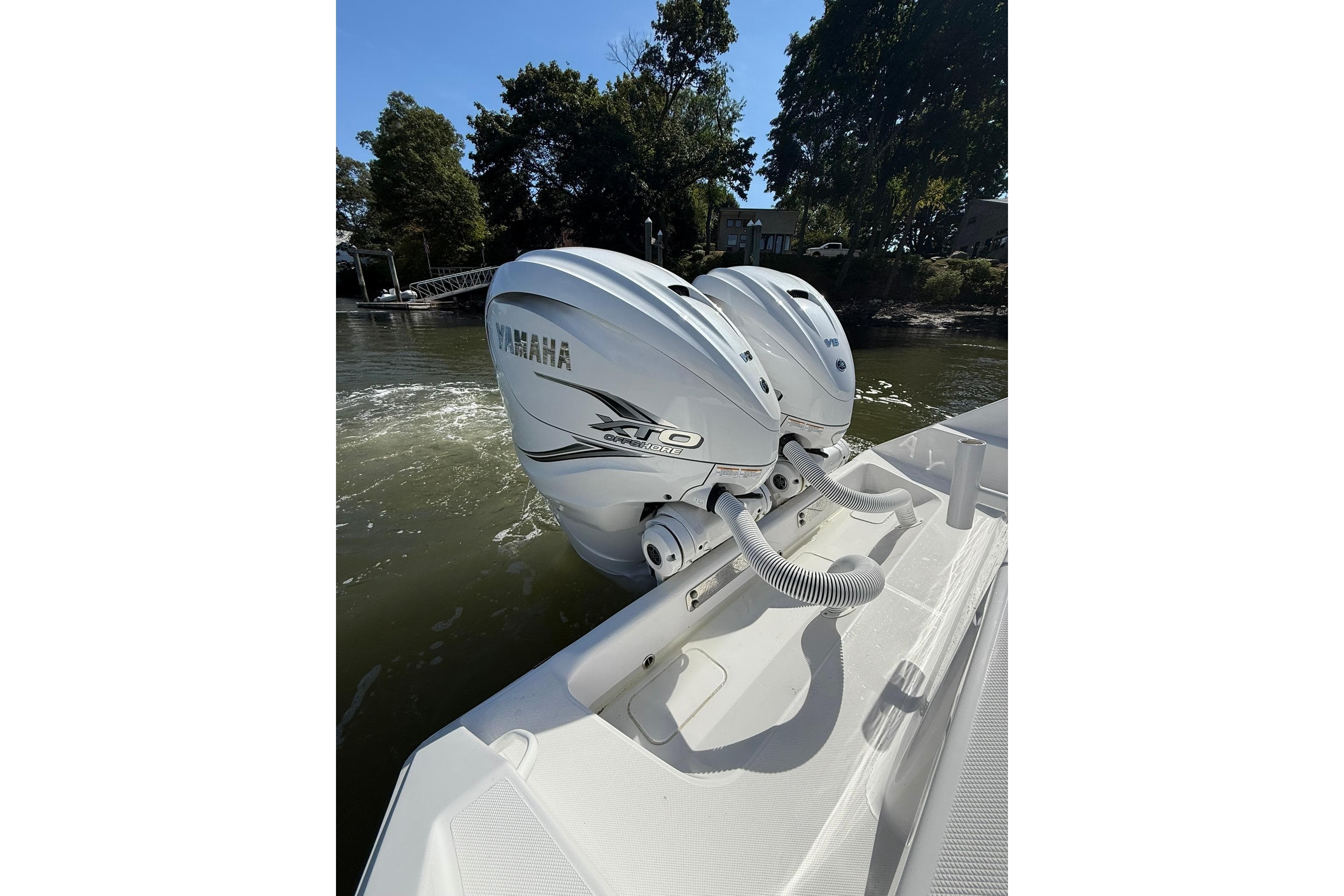 2021 Jupiter 38 HFS boat with dual Yamaha XTO outboard engines on water.
