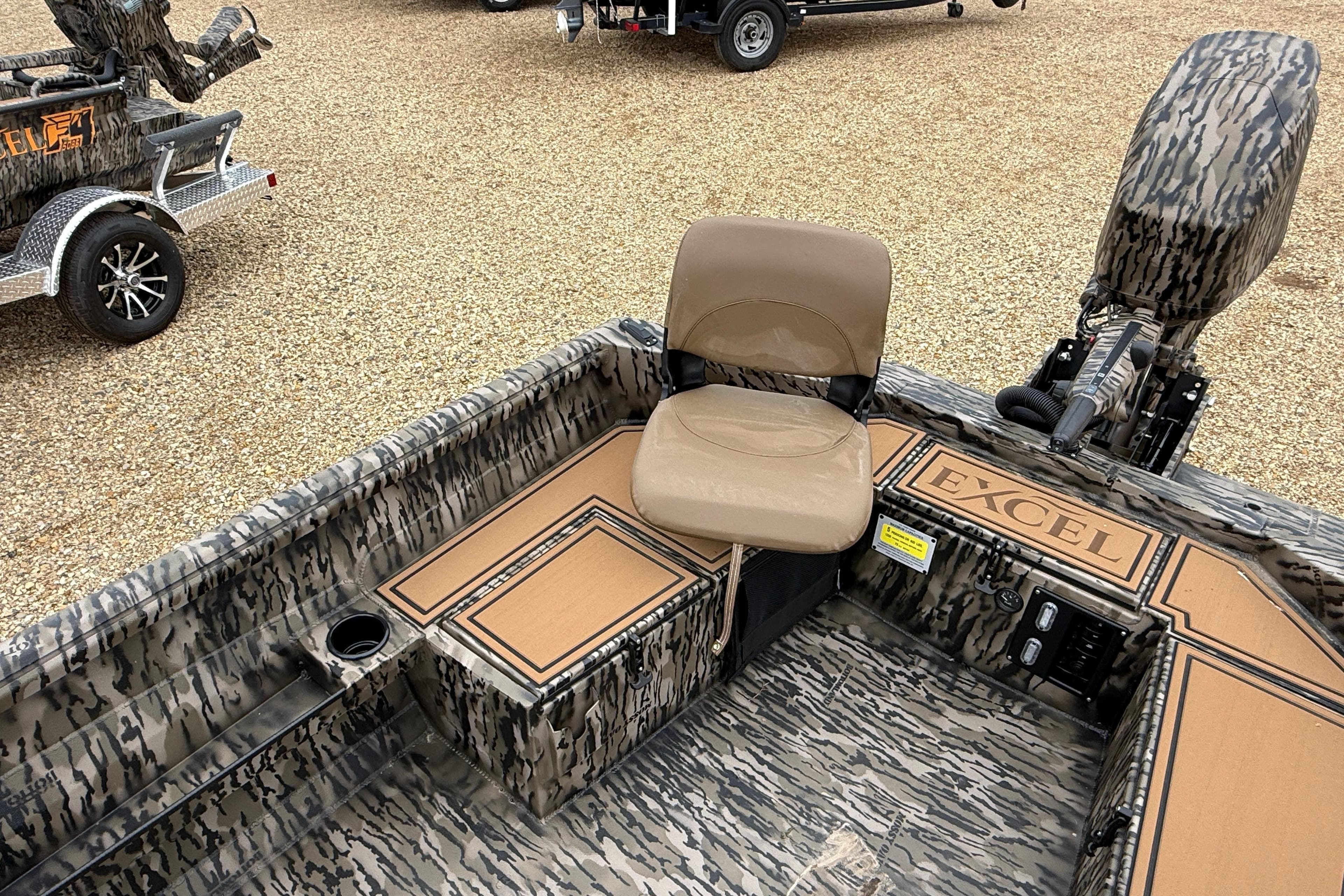 2026 Excel 1860 Viper F4 boat interior with camouflage design and seating.