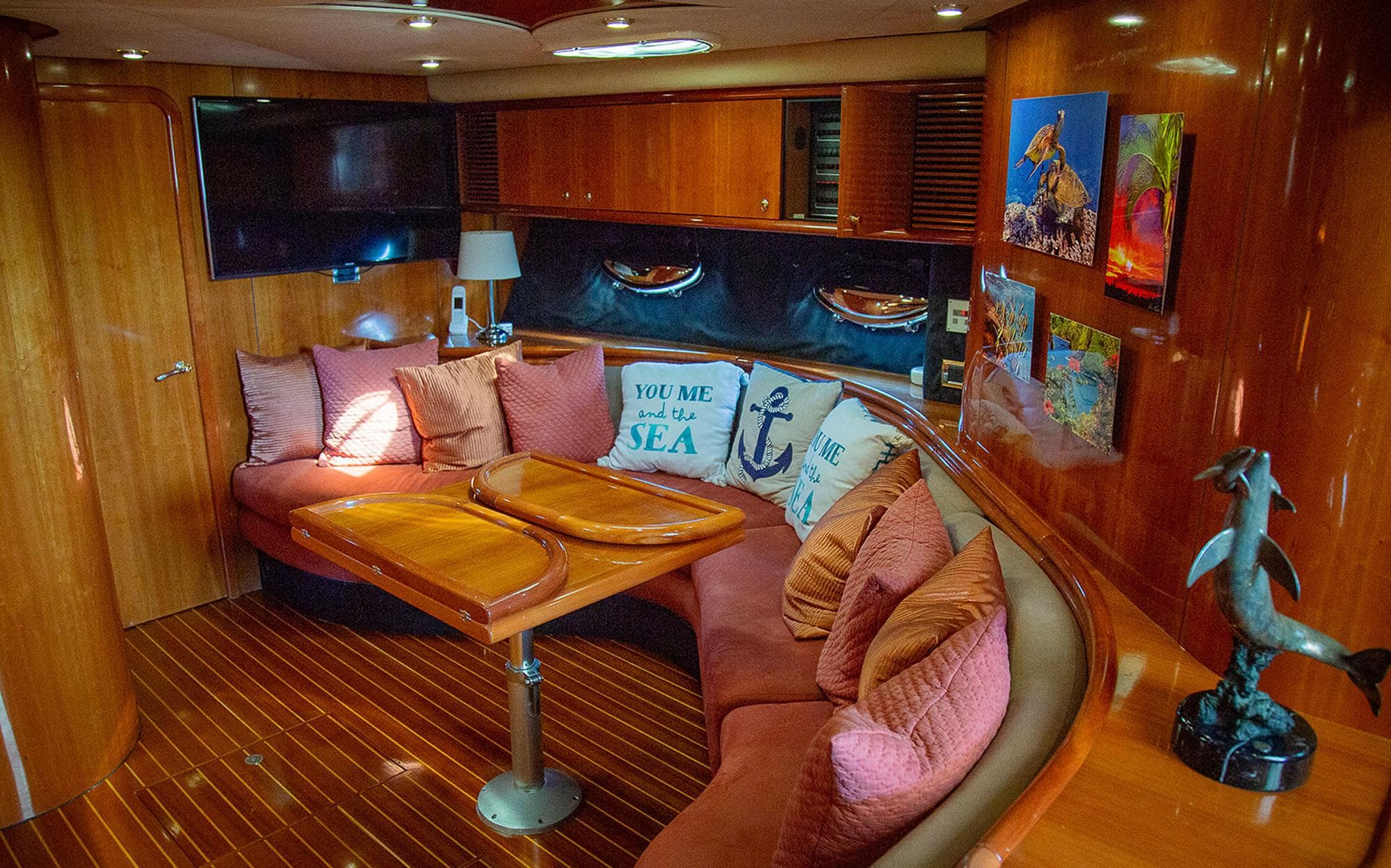 Luxurious interior of 1999 Sunseeker Predator 58 yacht with plush seating and elegant decor.