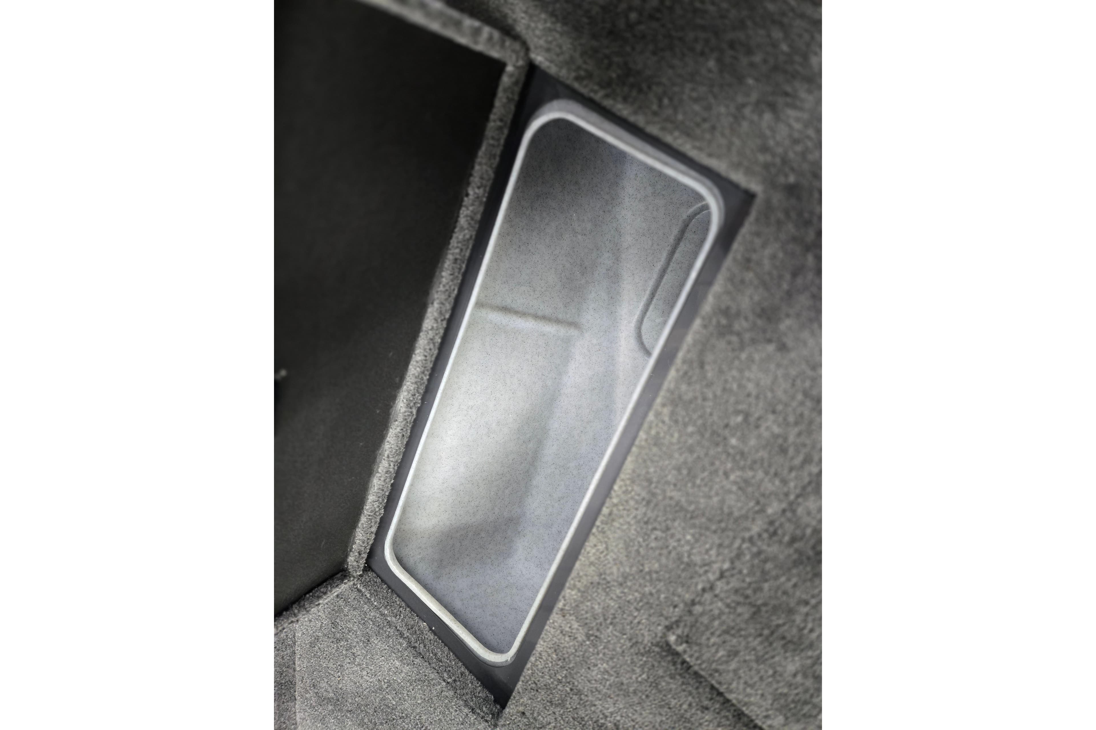 2026 Princecraft Sport 185 boat storage compartment with carpeted interior.