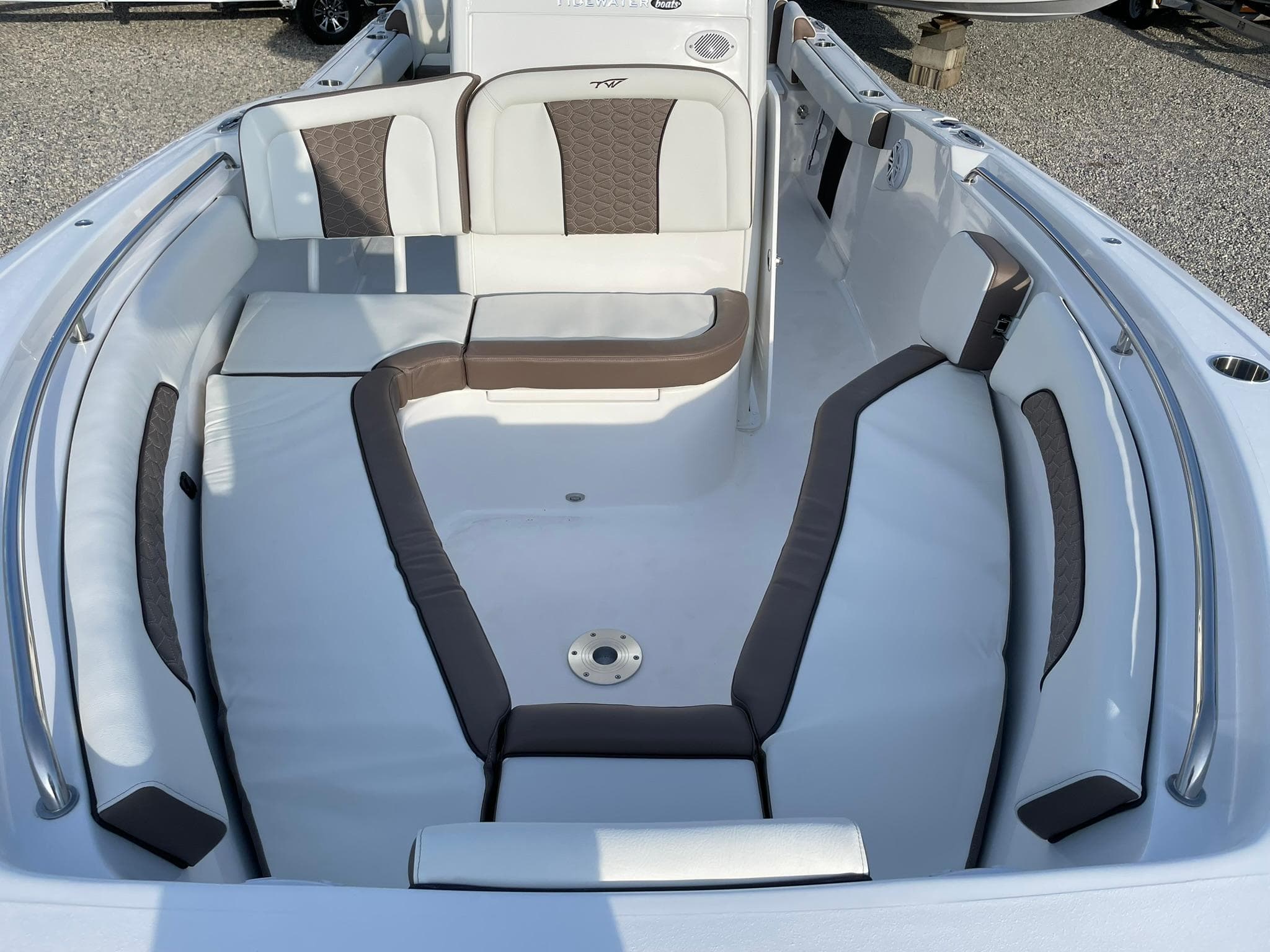 2025 Tidewater 232 SS boat interior with cushioned seating and sleek design.